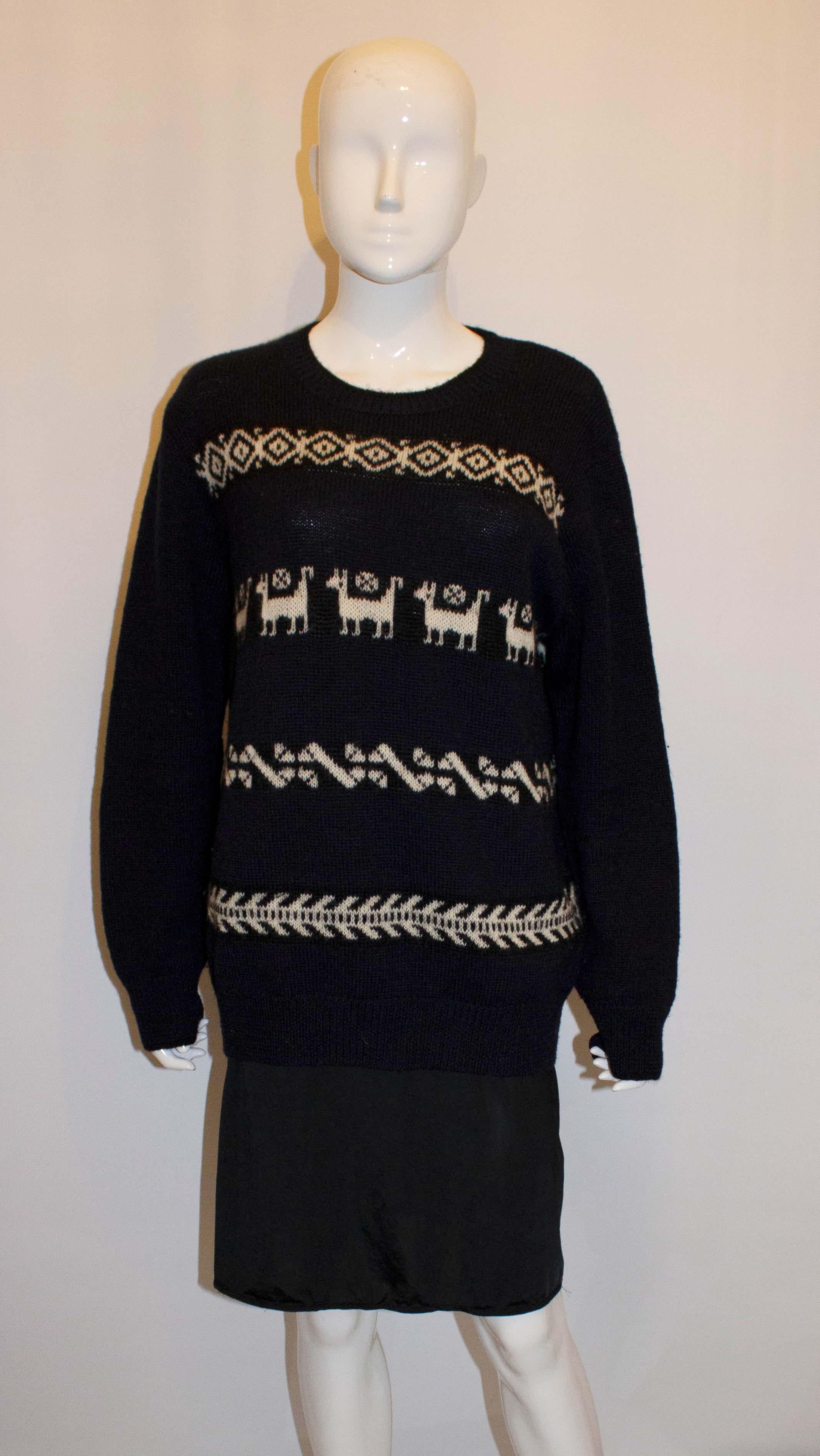 A wonderful jumper for Fall/ Winter by Dries van Noten. The jumper is in blue and white with a black trim around the neck and cuffs. Chest up to 50'', length 29''