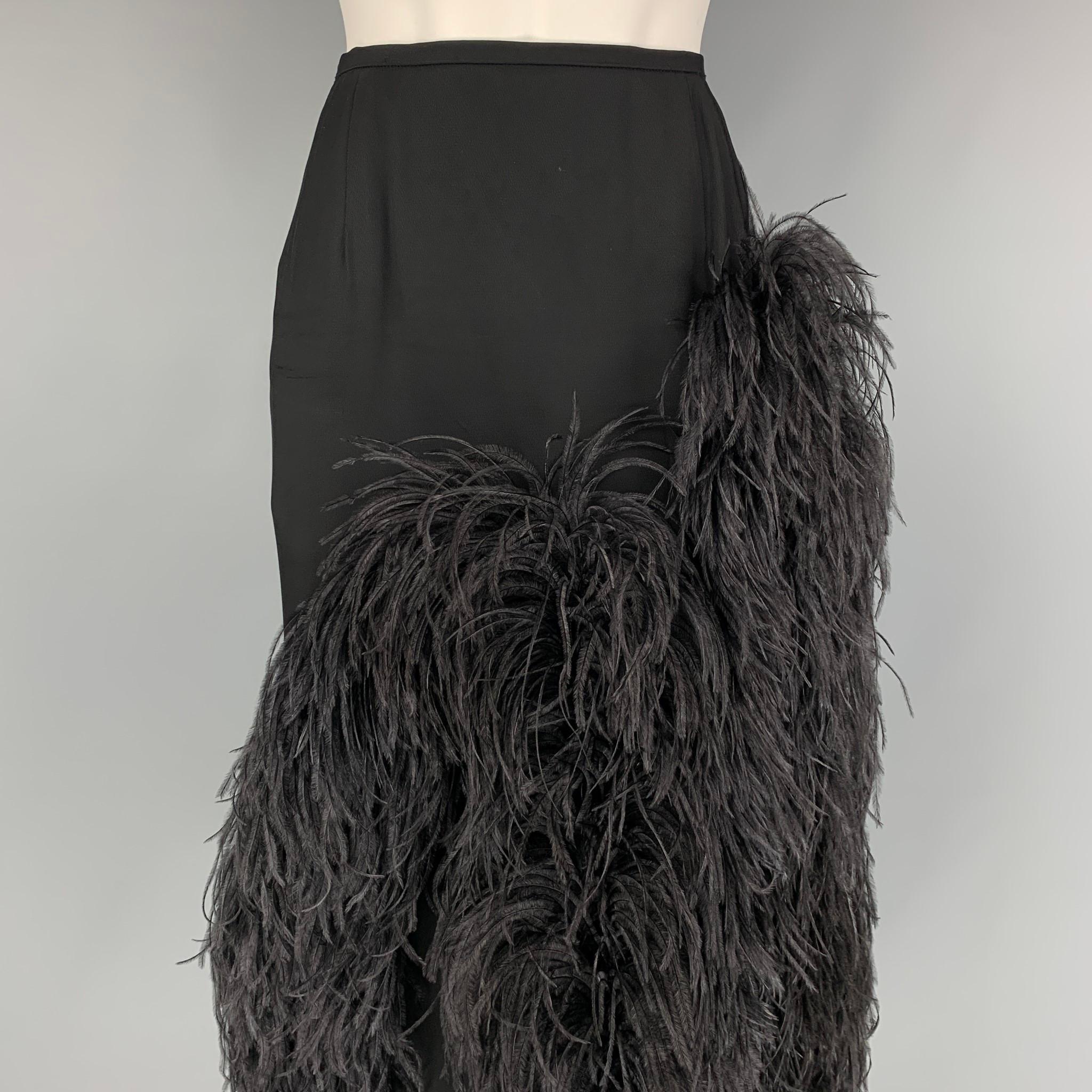 DRIES VAN NOTEN x Christian LaCroix skirt comes in a black viscose with a slip liner featuring a front feather design, front pleats, side slit, and a back zip up closure. Made in Belgium.

Very Good Pre-Owned Condition.
Marked: