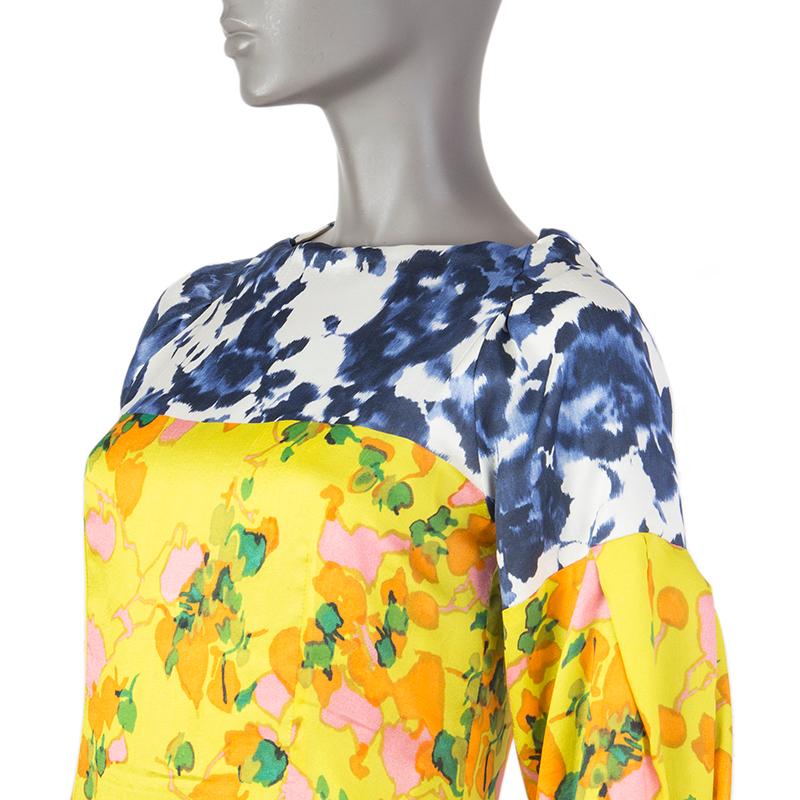 100% authentic Dries van Noten long-sleeve floral dress in lime, orange, pink, indigo, white, and green silk (100%). With boat neck and pleated sleeves. Closes with invisible zipper on the back. Lined in nacre silk (100%). Has been worn and is in