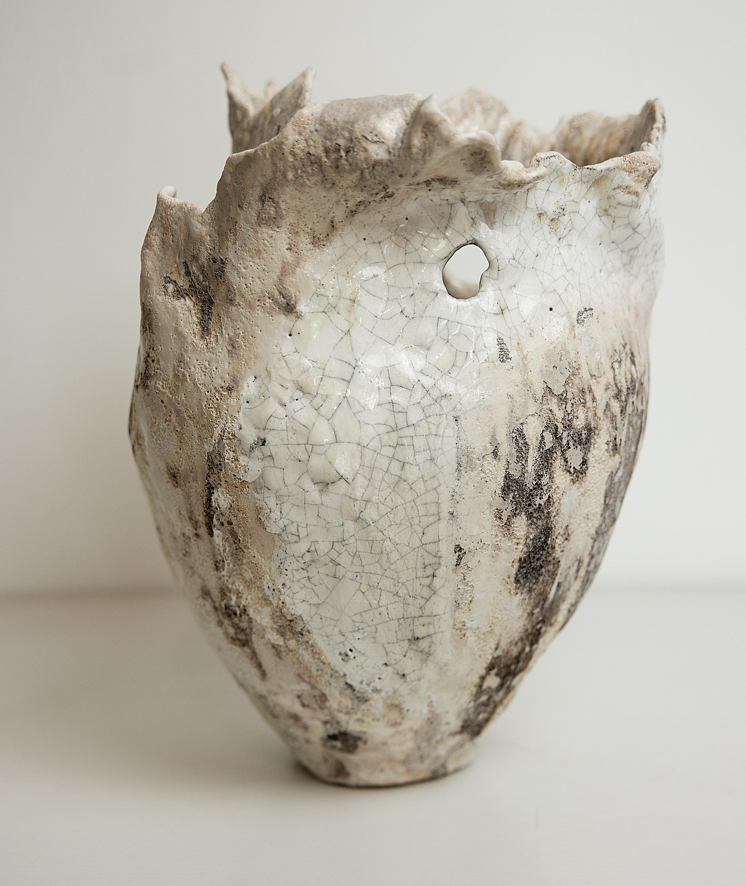 Bring a touch of modern style to your home with our Drift Torn Edge Vases
one of kind 
this White open  jar with Textured drips and lava glaze
one of a kind
TEXTURED 

., each striking vase features a unique, moon-like design in an eye-catching