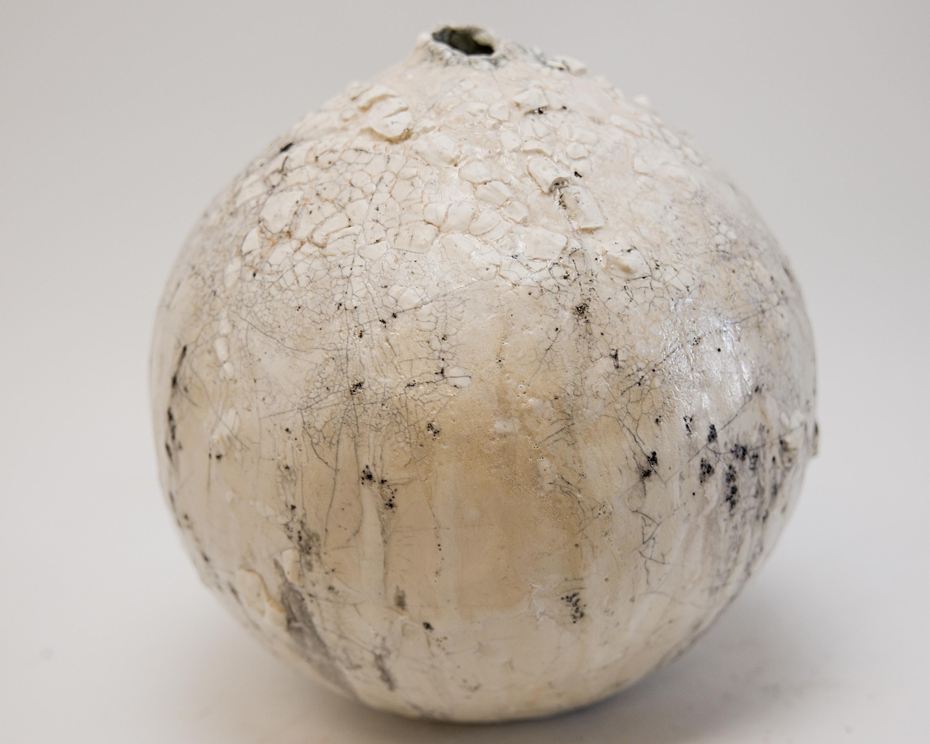 Bring a touch of modern style to your home with our Cream texture Moon vases
one of kind 
this White moon jar with Textured drips 
 Matt glaze 
one of a kind

., each striking vase features a unique, moon-like design in an eye-catching light lava