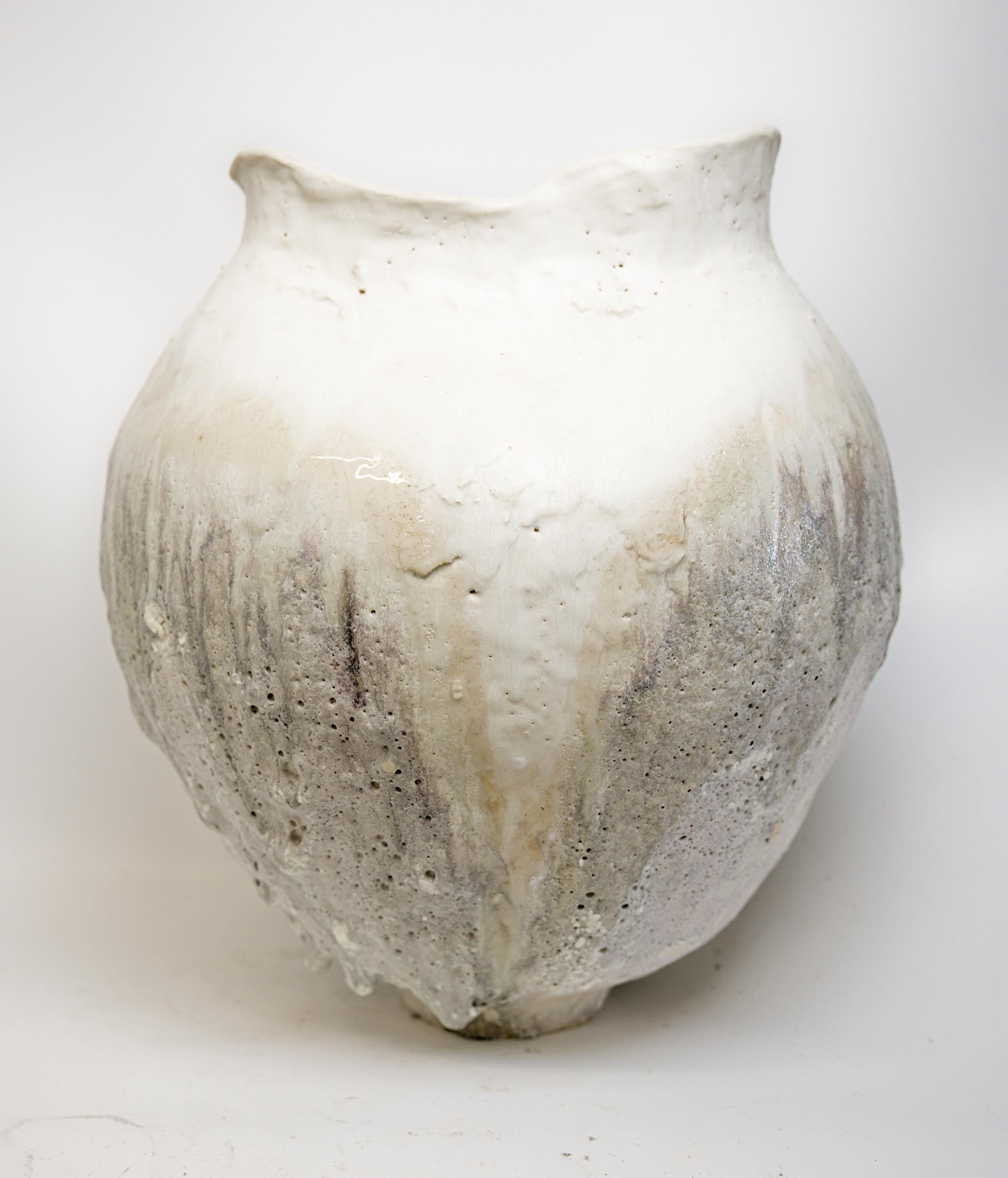 Bring a touch of modern style to your home with our Cream texture Moon vases
one of kind 
this White moon jar with Textured drips 
 Matt glaze 
one of a kind

., each striking vase features a unique, moon-like design in an eye-catching light lava