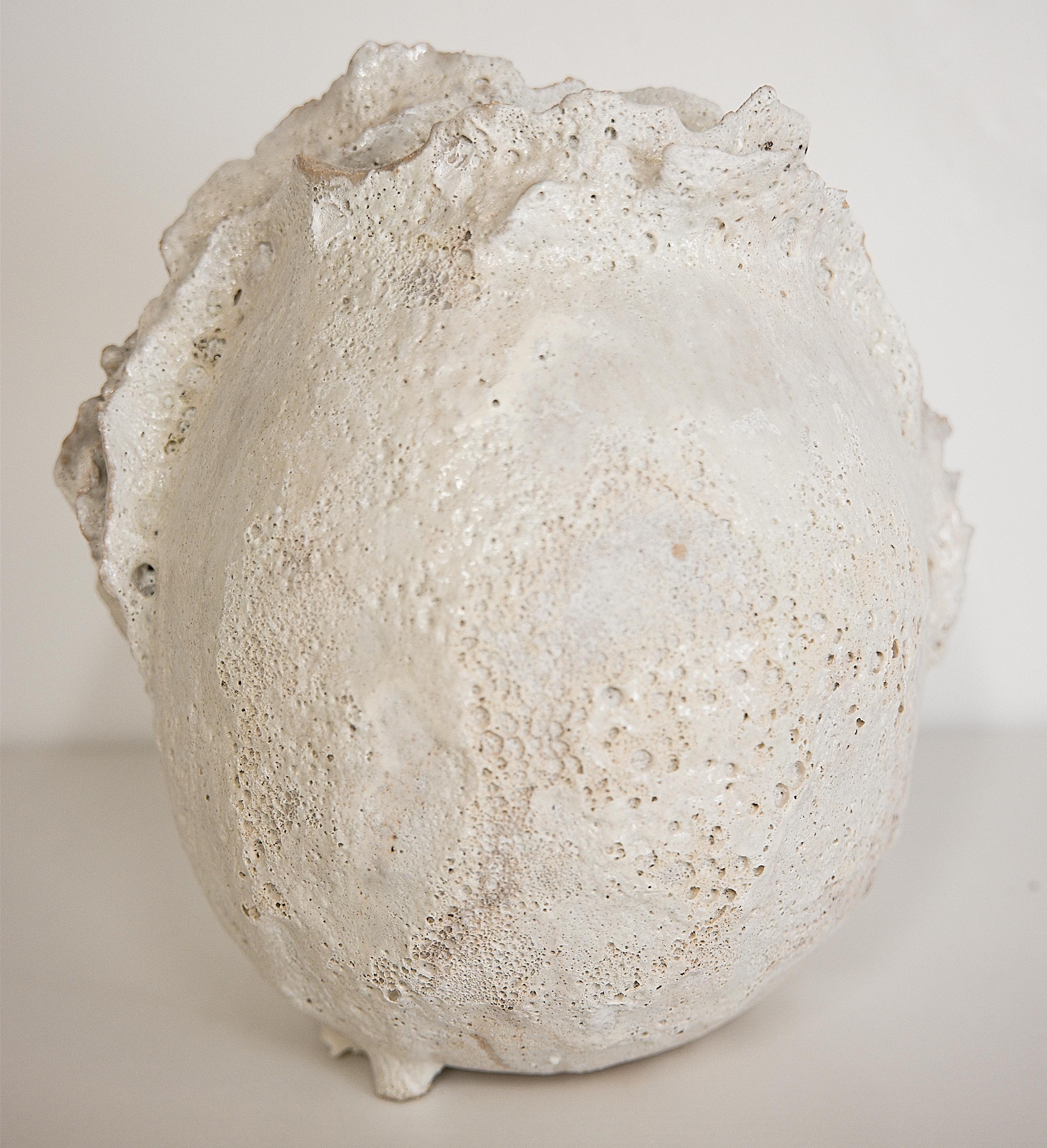 Bring a touch of modern style to your home with our Drift Torn Edge Vases
one of kind 
this White moon jar with Textured drips and lava glaze
one of a kind

., each striking vase features a unique, moon-like design in an eye-catching light lava