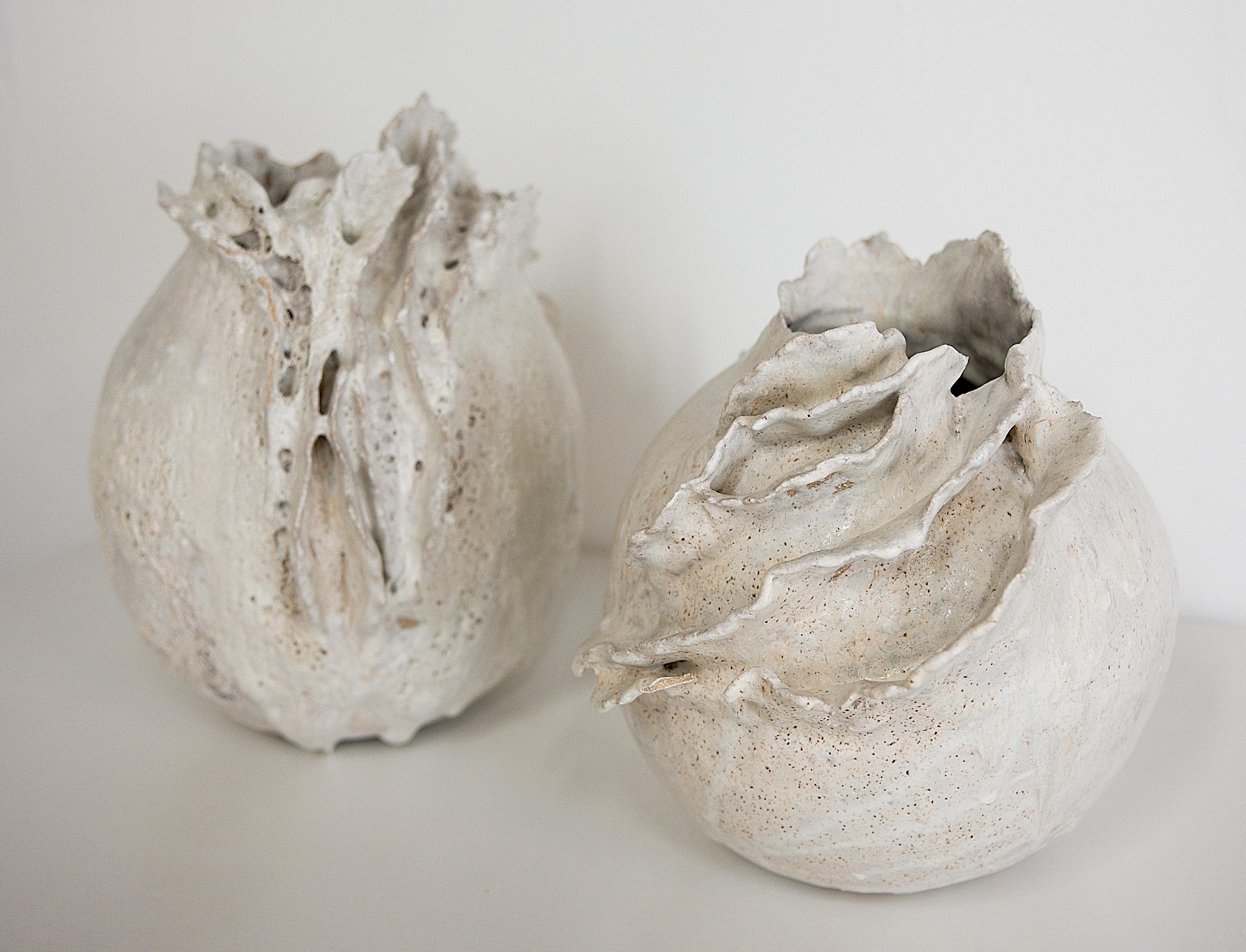 Bring a touch of modern style to your home with our Drift Torn Edge Vases
one of kind 
this White moon jar with Textured drips 
Oatmeal Matt glaze 
one of a kind

., each striking vase features a unique, moon-like design in an eye-catching light