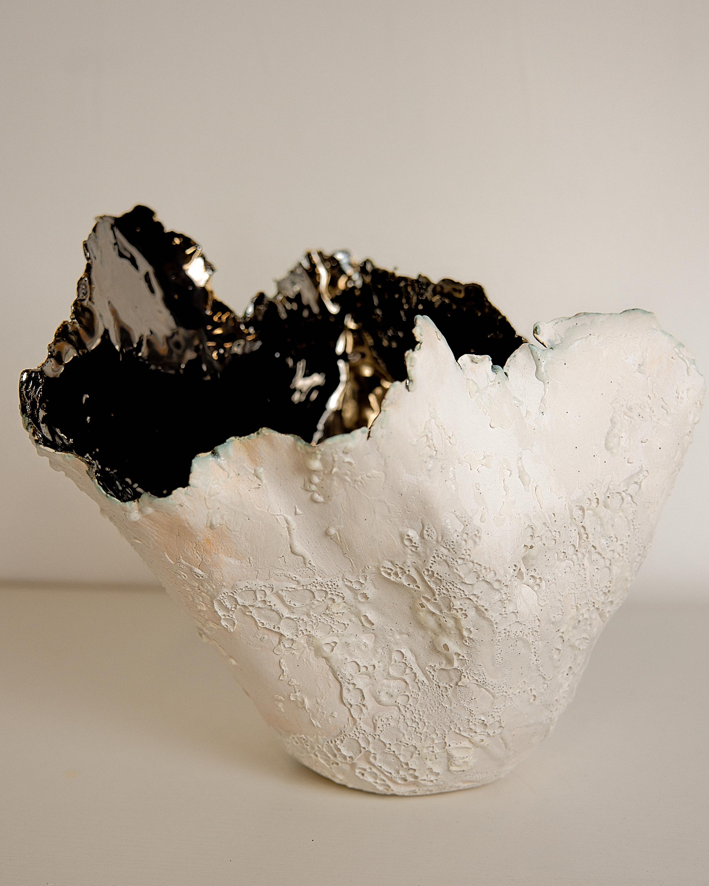 Bring a touch of modern style to your home with our Drift Torn Edge Vases
one of kind 
this White open  jar with Textured drips and lava glaze
one of a kind
Mirror glazed inside. one of a kind 

., each striking vase features a unique, moon-like