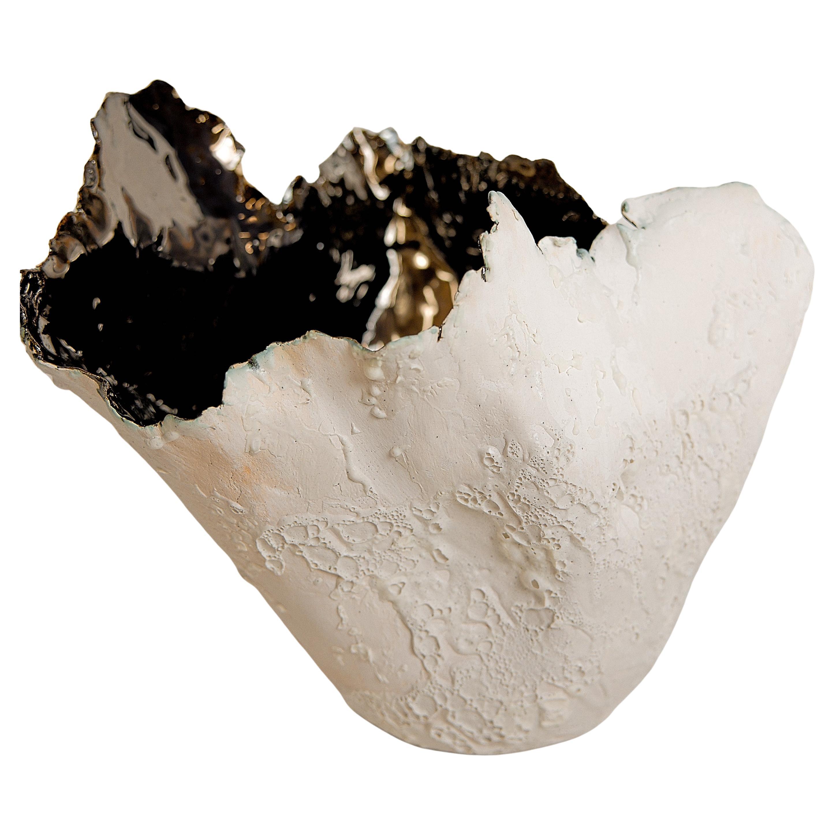Bring a touch of modern style to your home with our Drift Torn Edge Vases
one of kind 
this White open  jar with Textured drips and lava glaze
one of a kind
Mirror glazed inside. one of a kind 

., each striking vase features a unique, moon-like