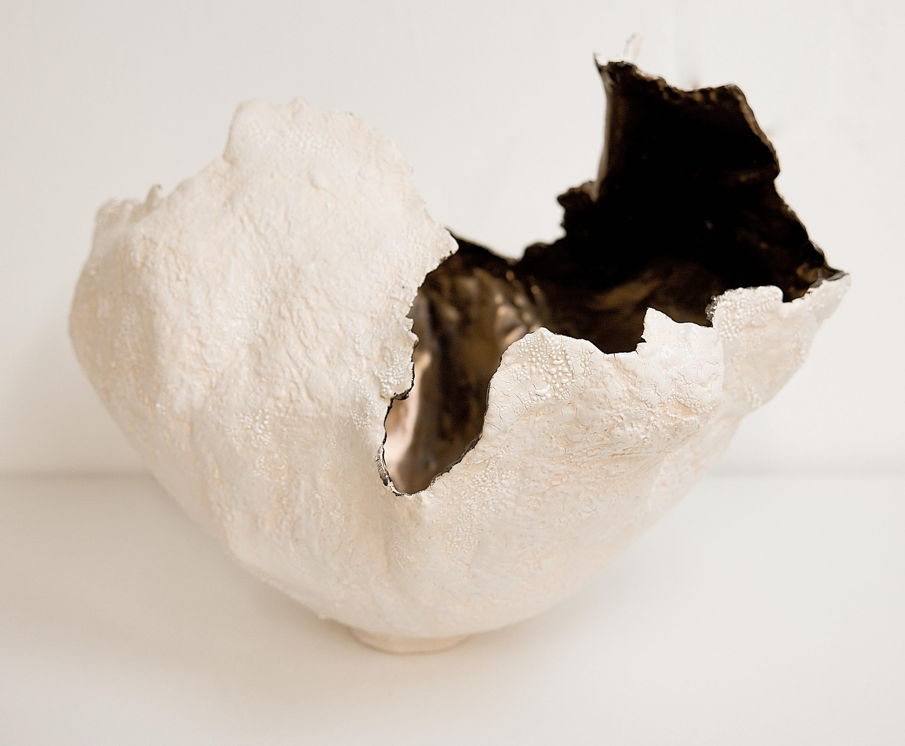 Bring a touch of modern style to your home with our Drift Torn Edge Vases
one of kind 
this White open  jar with Textured drips and lava glaze
one of a kind
saturated GOLD inside. one of a kind 

., each striking vase features a unique, moon-like