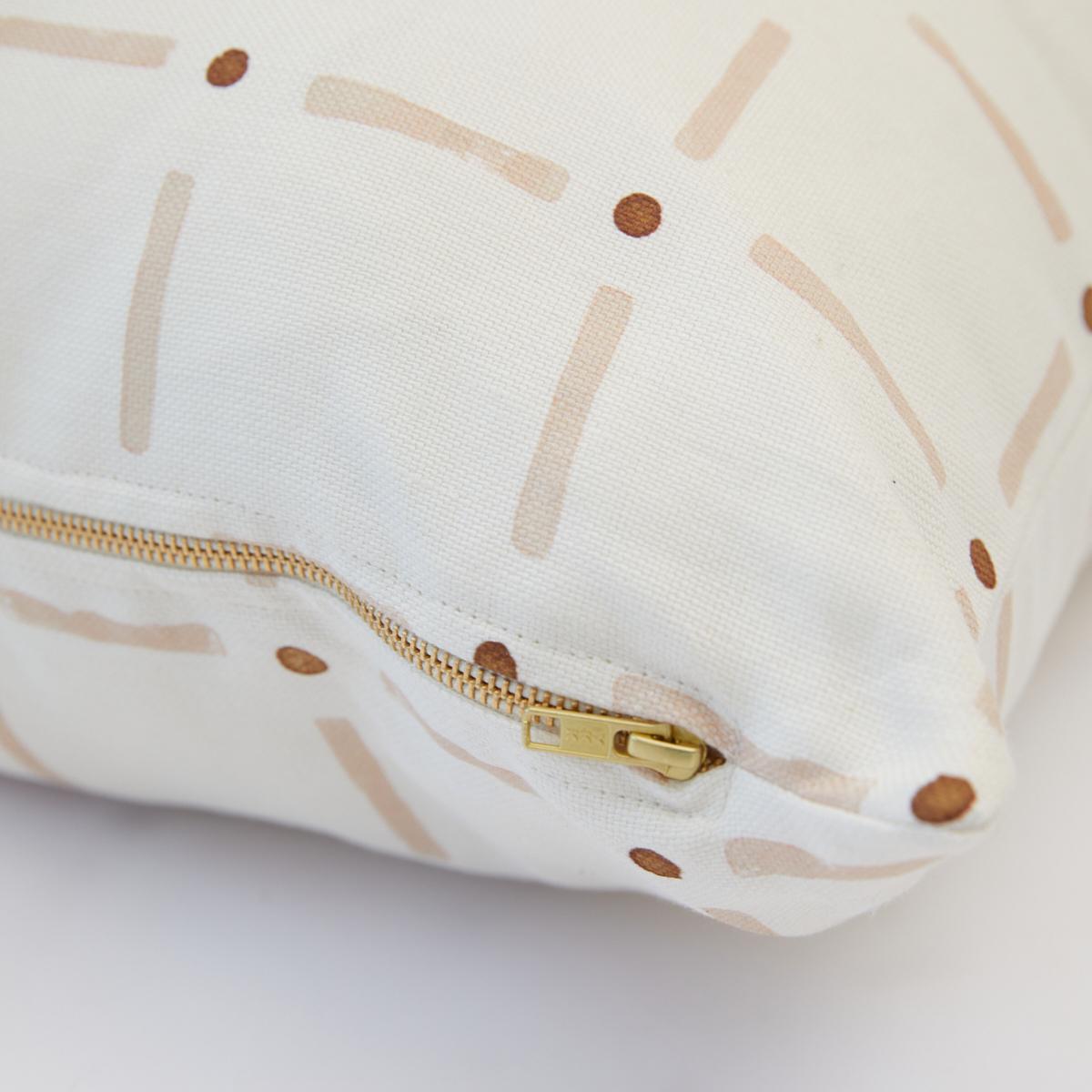 This pillow features Drifting Grid by Caroline Z Hurley with a knife edge finish. Our Drifting Grid pillow is a playful take on plaid – a perfect blend of tradition and whimsy. Our petal colorway marries a subtle blush with accents earthy