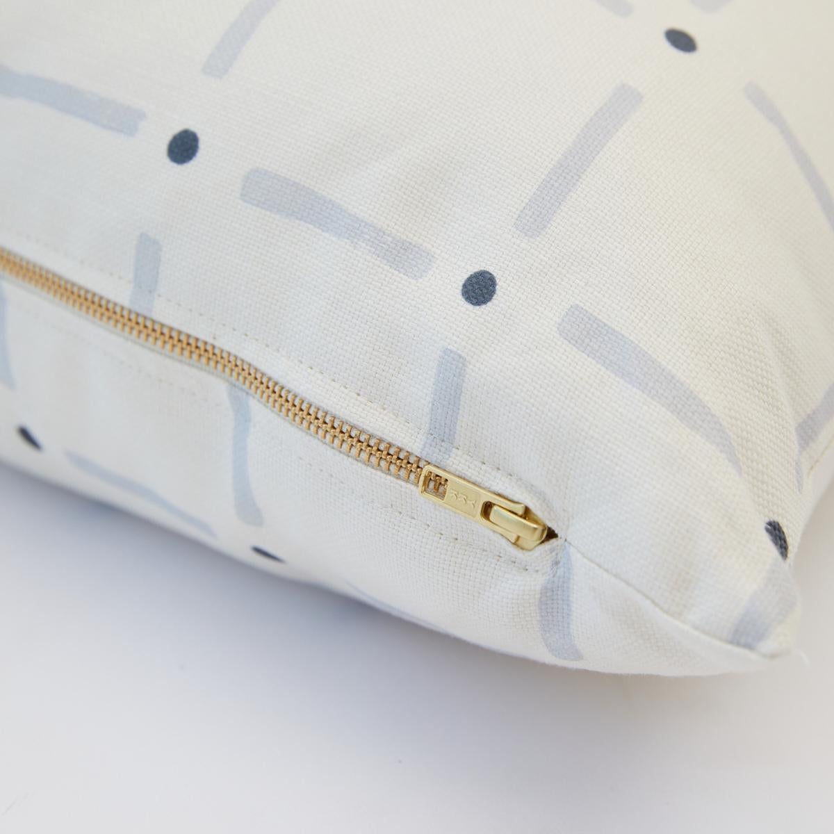 This pillow features Drifting Grid by Caroline Z Hurley with a knife edge finish. Our Drifting Grid pillow is a playful take on plaid – a perfect blend of tradition and whimsy. Our petal colorway marries a subtle blush with accents earthy