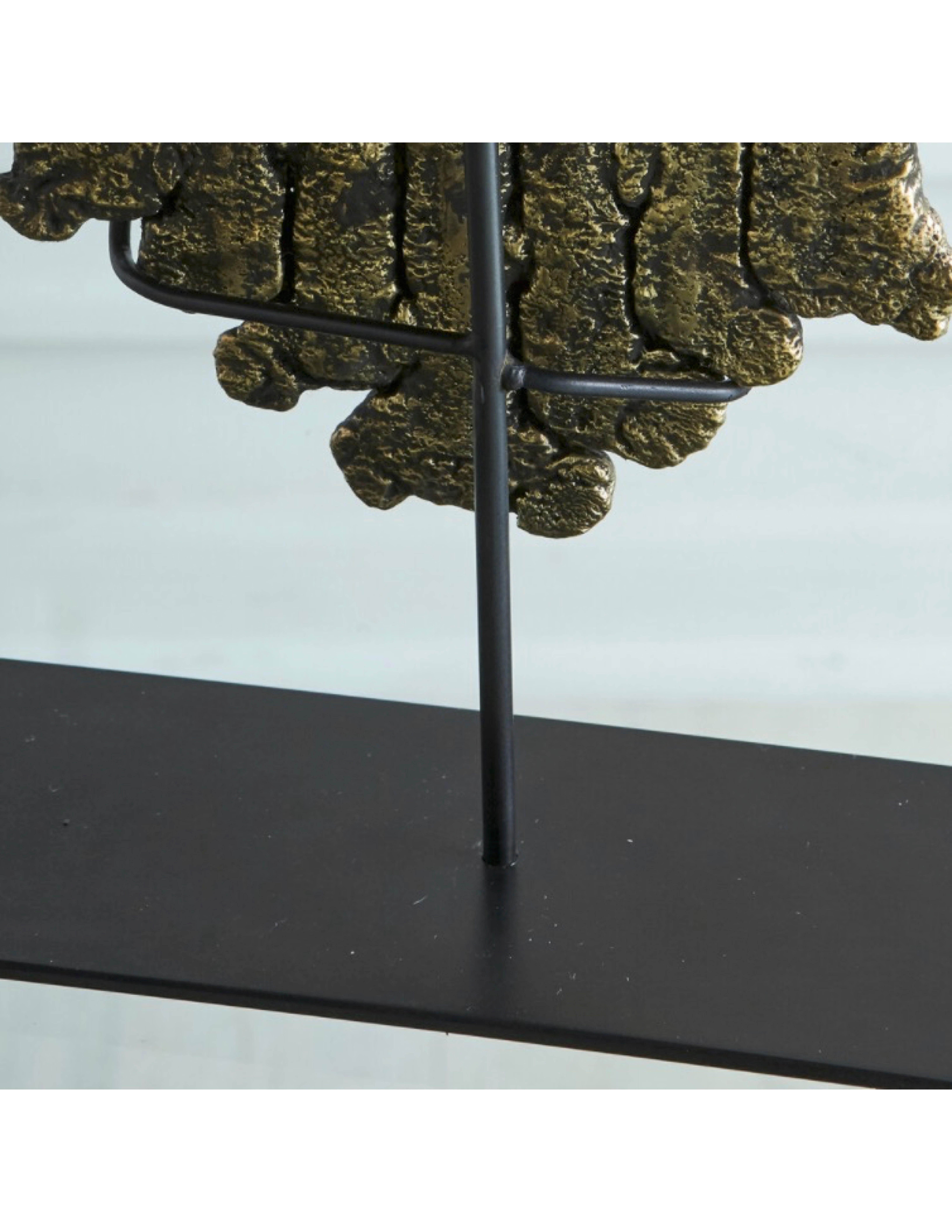 A bespoke and beautifully textured sculpture cast from molten brass and displayed on an iron stand. Made in Chicago by Circa 3230.