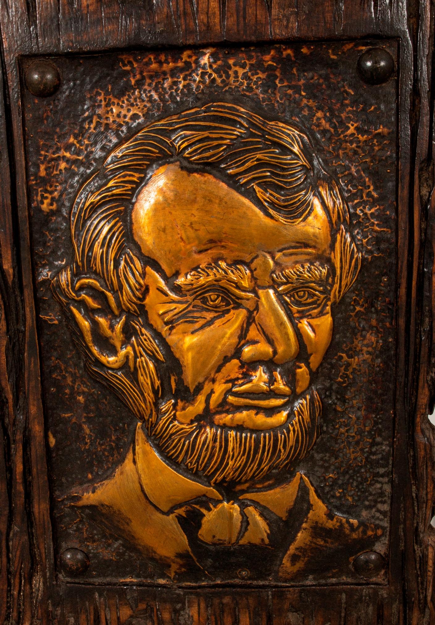 Driftwood and Tim Plaque of Abraham Lincoln. Label affixed to verso.