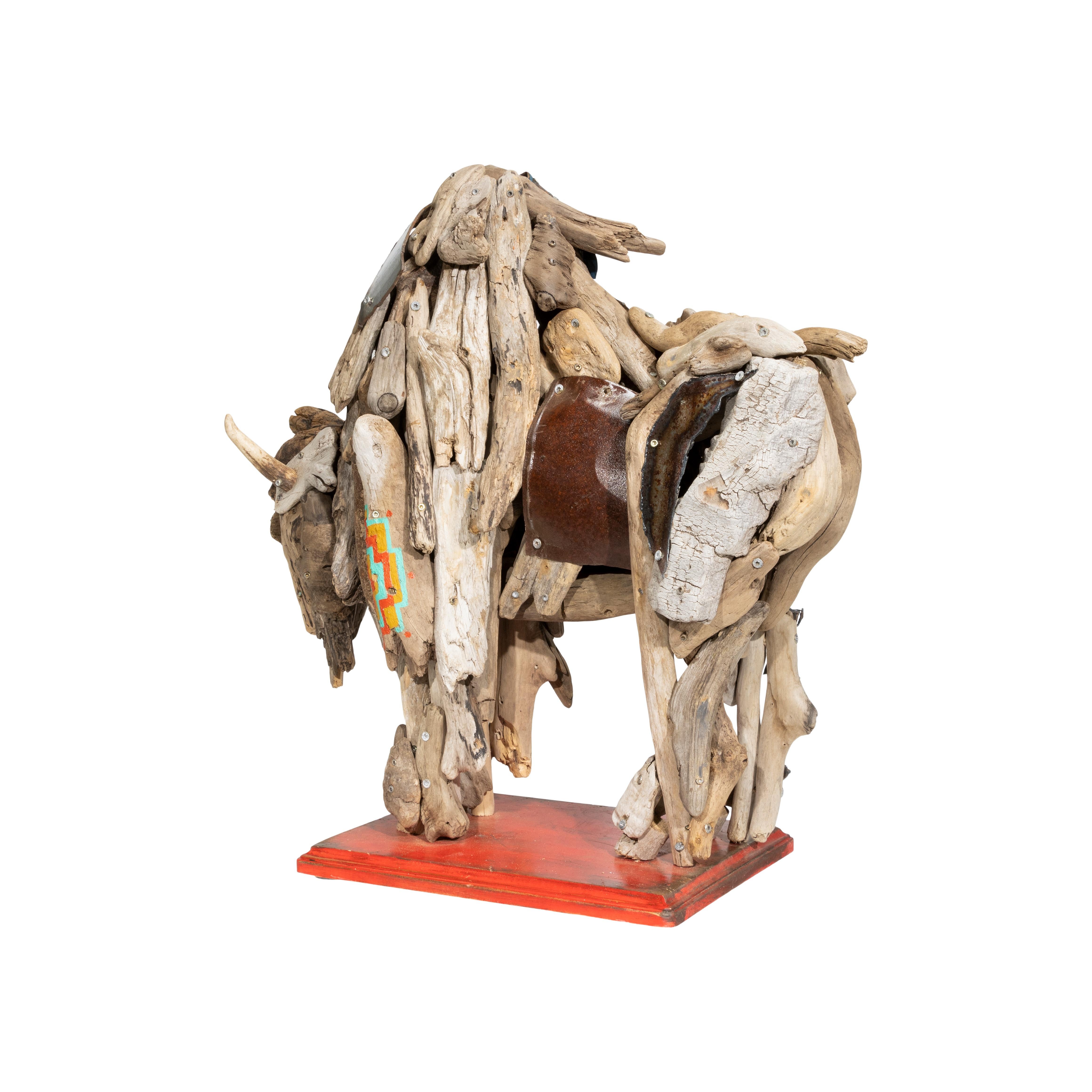 Large driftwood buffalo. Natural ends with scrap yard steel by a Montana artist. 21” x 20” x 9”

Period: Contemporary
Origin: Montana, United States
Size: 21” x 20” x 9”

Tina grew up in the beauty of Colorado, the breath-taking rugged