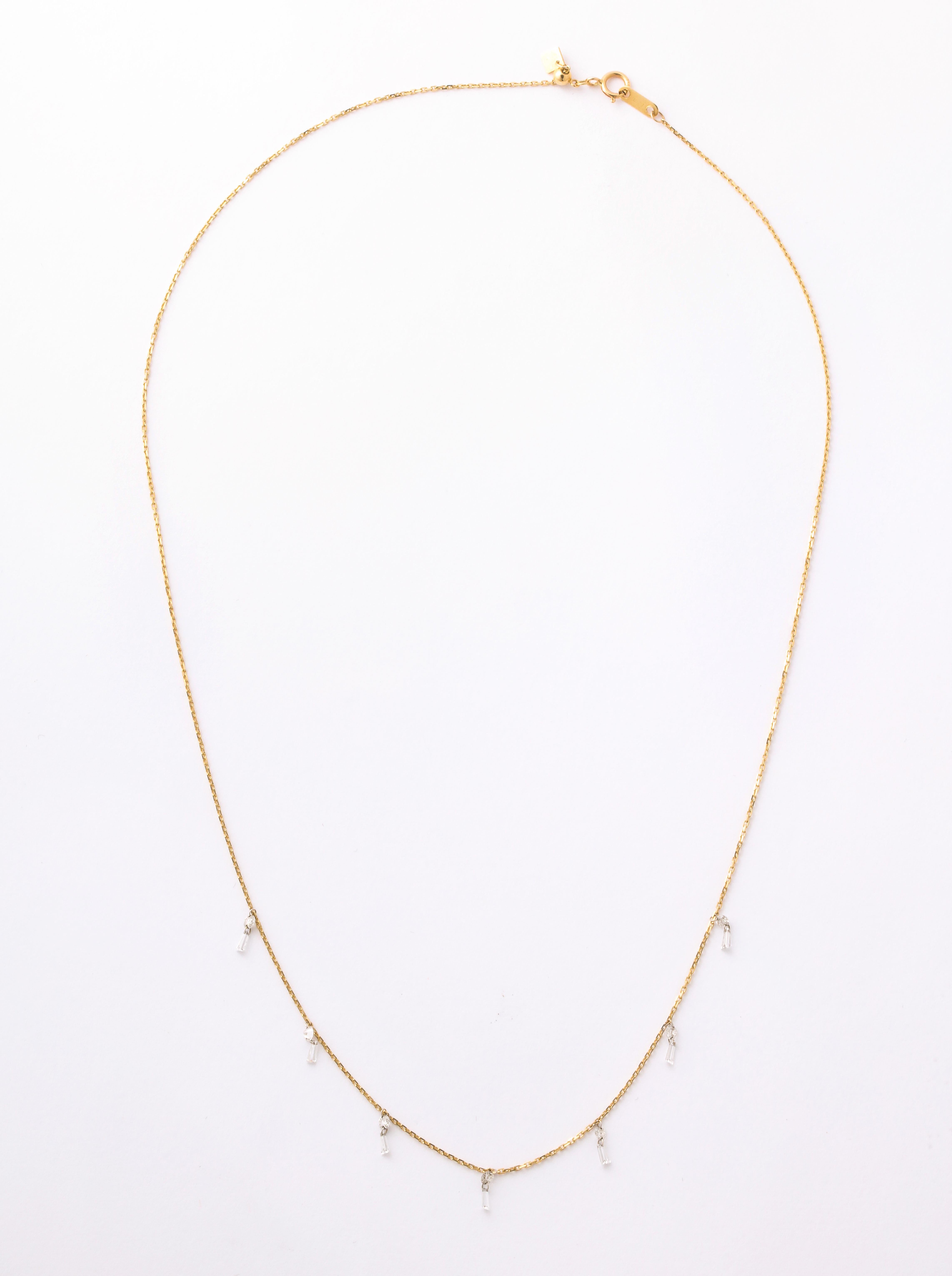   Drilled Baguette Diamonds are suspended on an 18K fine gold chain, making 
  this easily  wearable along with other necklaces.  This is so comfortable you never 
 want to take it off.