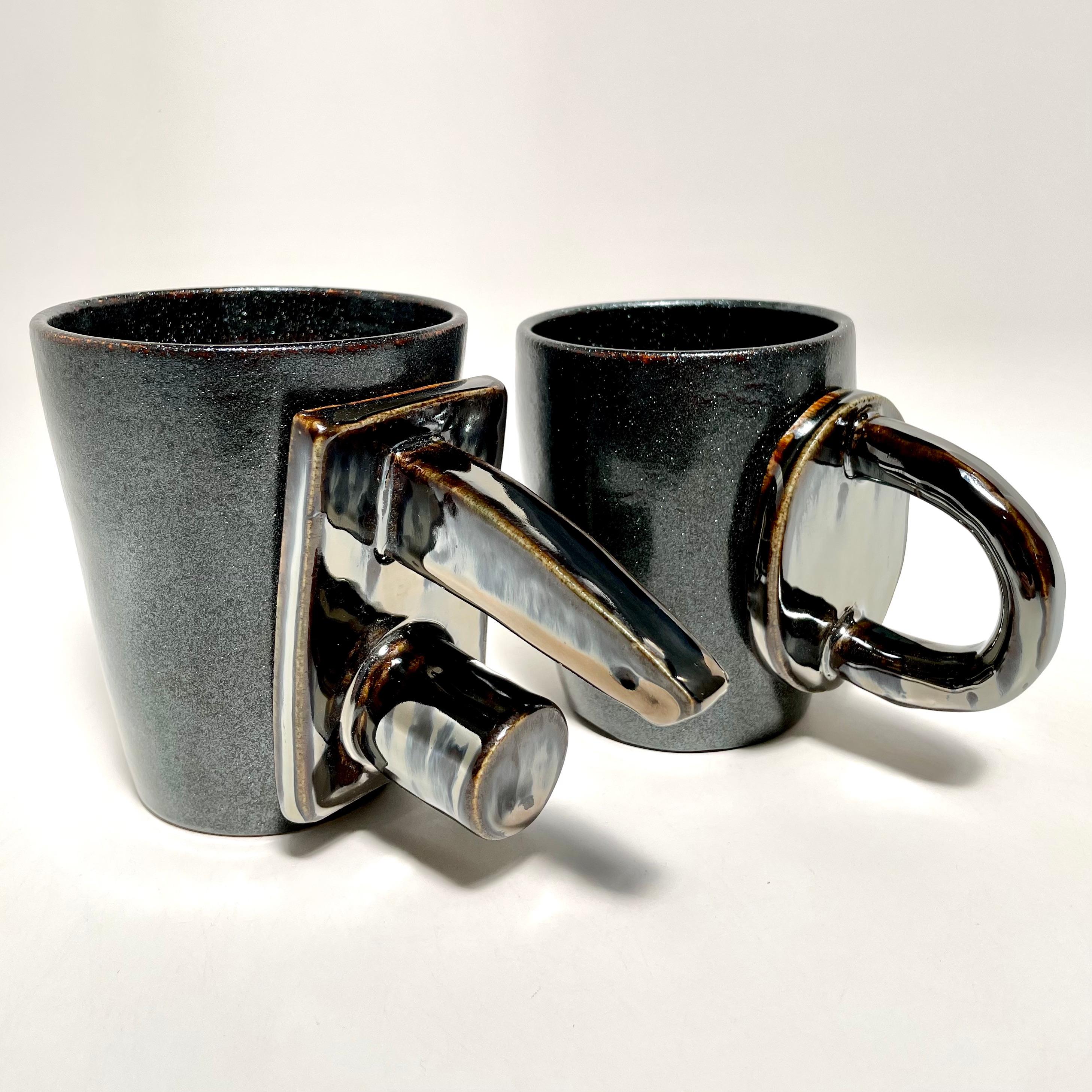 The D:Ring, shown here in Epsilon and Broken Silver, the food safe vessel for your favorite beverage of choice, entertaining, or as a decorative object or object d'art. Versatile, sustainable and one of kind, made of recycled stoneware and 100% lead