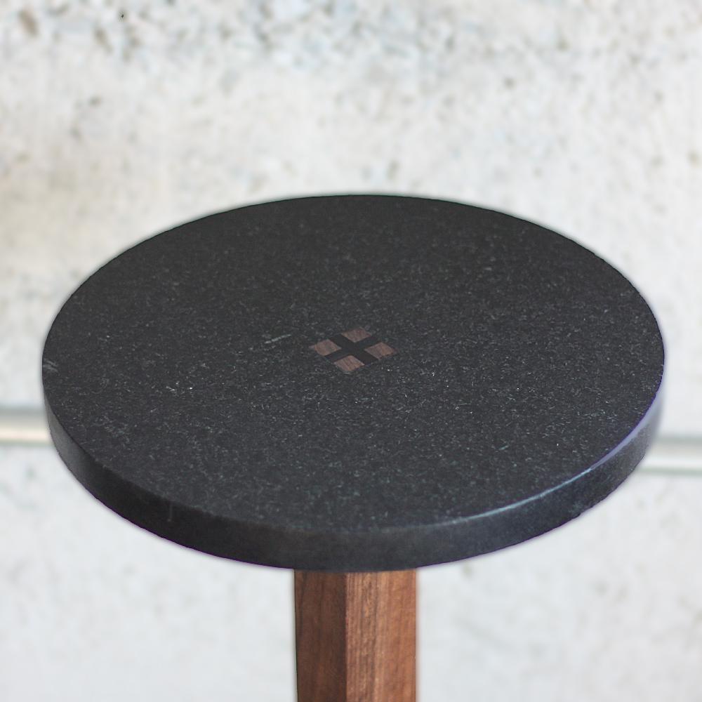 Black granite top joined to solid walnut base by ebony wedges driven permanently into place. Japanese style joinery at base creates a solid platform for a drink at fingers reach from favorite lounge chair or sofa. Handcrafted in Los Angeles in small