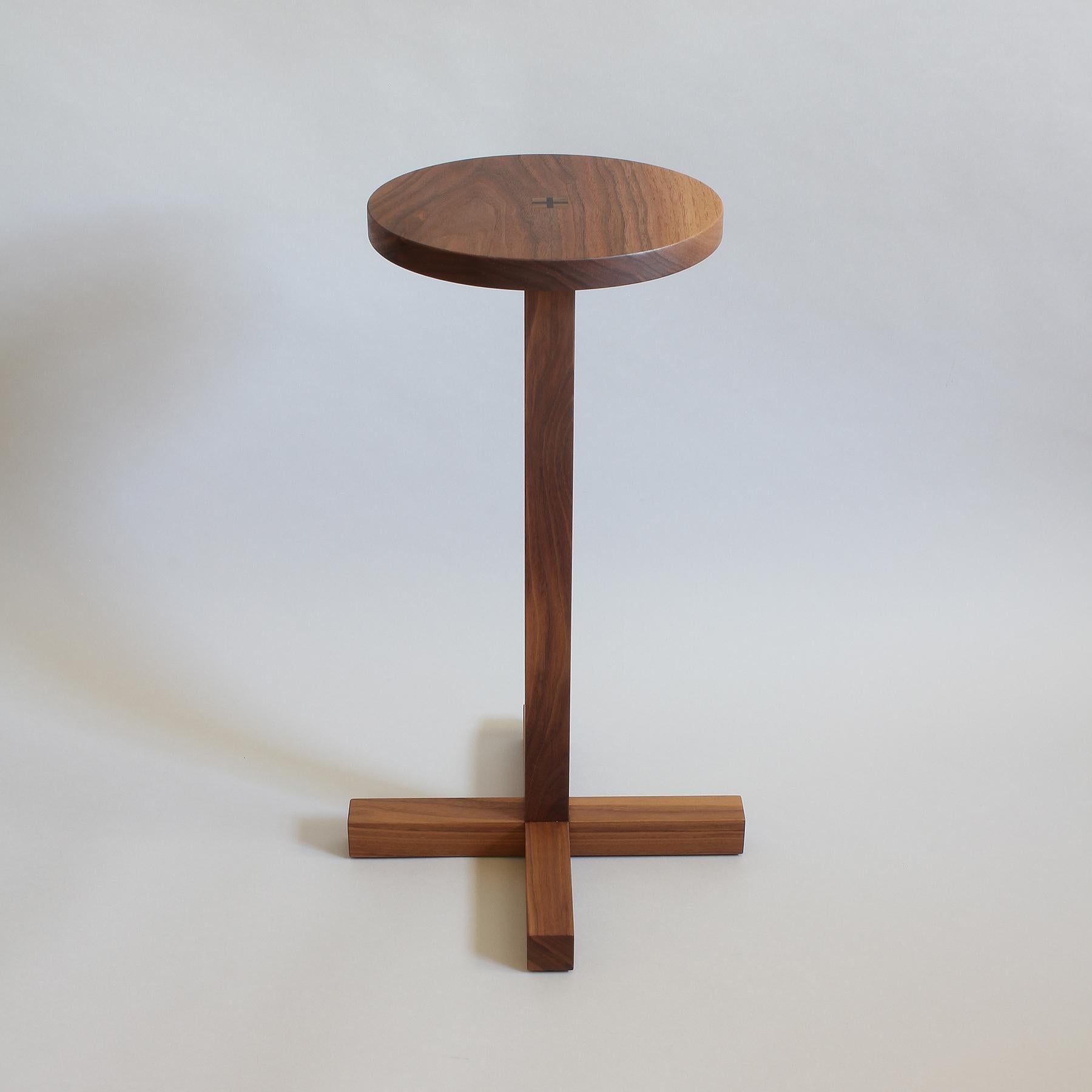 Drink Table with solid California Black Walnut top joined to a solid walnut base.  Ebony wedges are driven into place to lock the  top with the base. The base is constructed with traditional Japanese joinery for structure with no hardware, creating