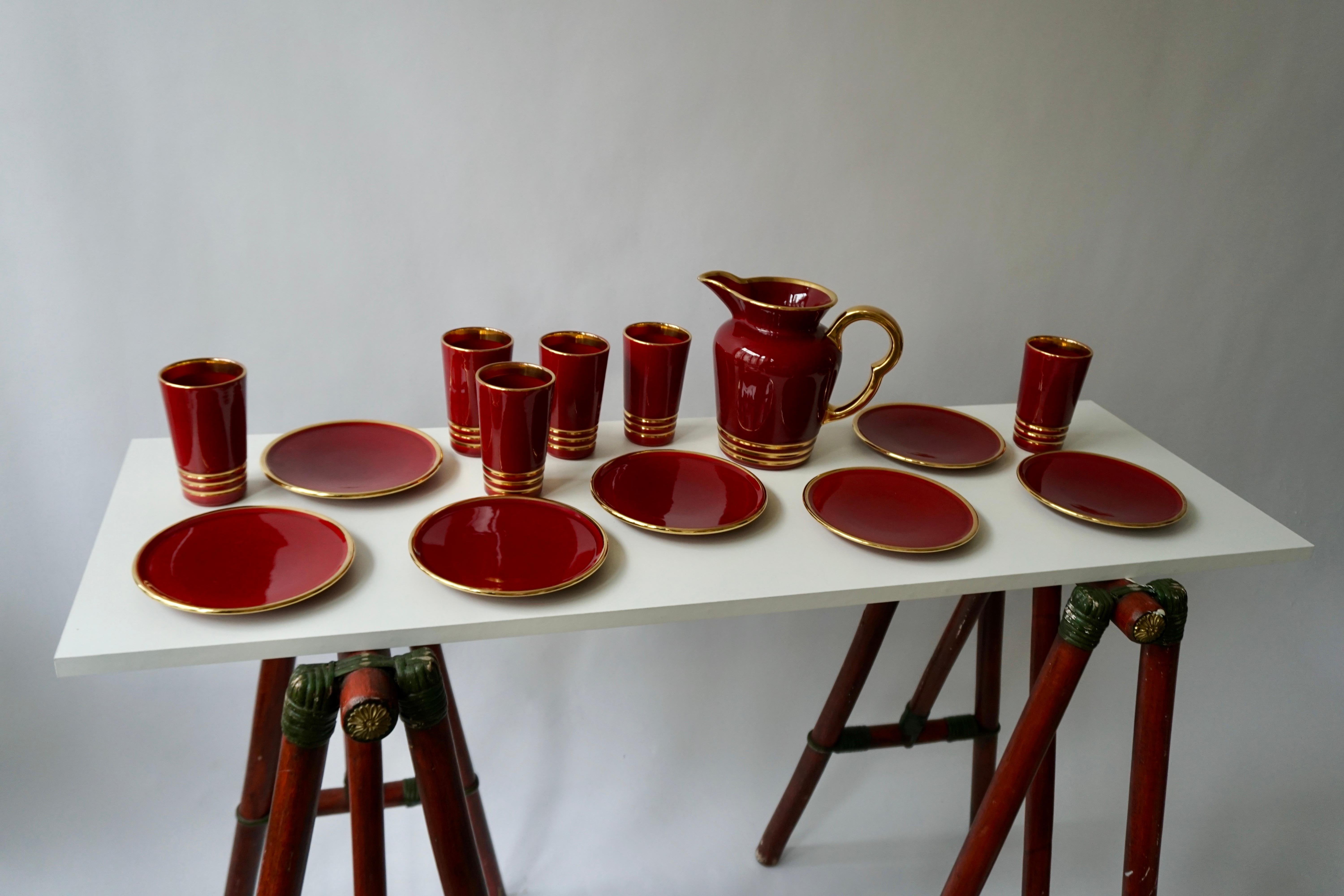 Very nice complete ceramic drinking set designed by Magdalithe, France in the 1960s.
This ceramic set is in good condition and complete: 6 cups, a jug and seven plates.
Measures: Height cups 13 cm, diameter 7.5 cm.
Height jug 20 cm, width 23 cm,