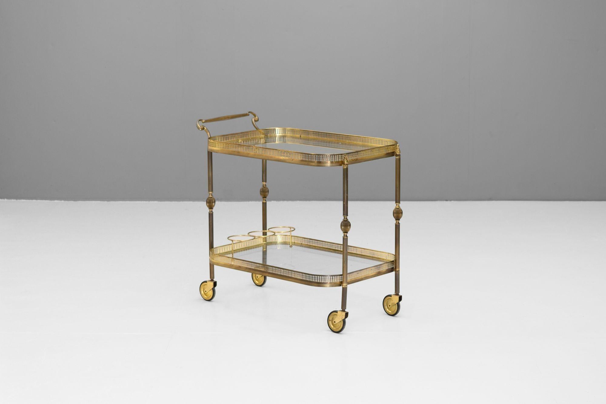 Brass framed two tier French drinks trolley. Circa1930
H 70cm x W 44cm x D 76cm