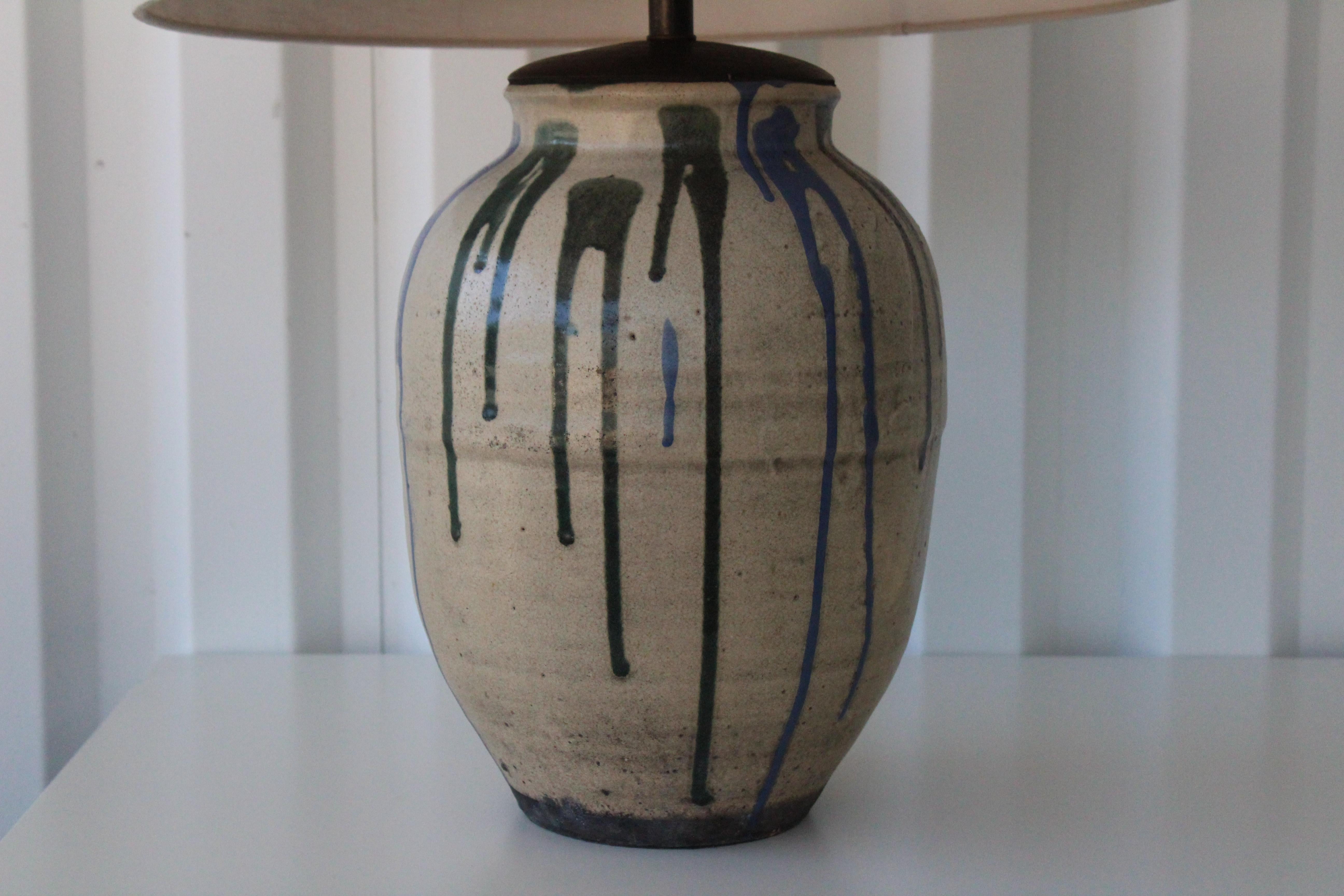 1960s Japanese pottery vase custom made into a table lamp. Blue and green drip glazed. Newly rewired and fitted with a custom linen shade.