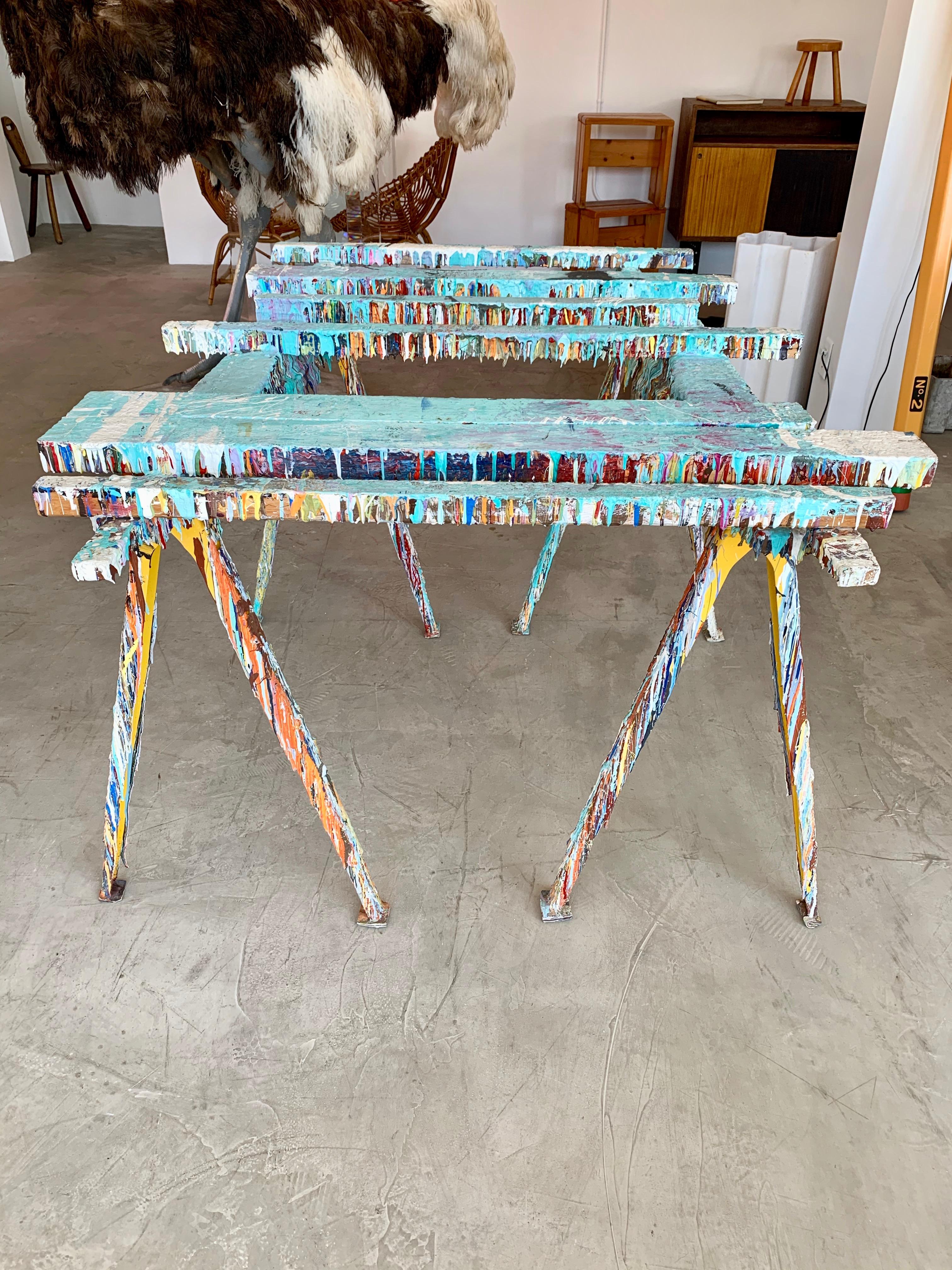 Fantastic table in the style of Gaetano Pesce. Wood saw house table with horizontal slats and folding metal legs. Entire table frame and legs covered in drip paint. Super cool piece of art. Glass tabletop with desired dimensions included in sale.