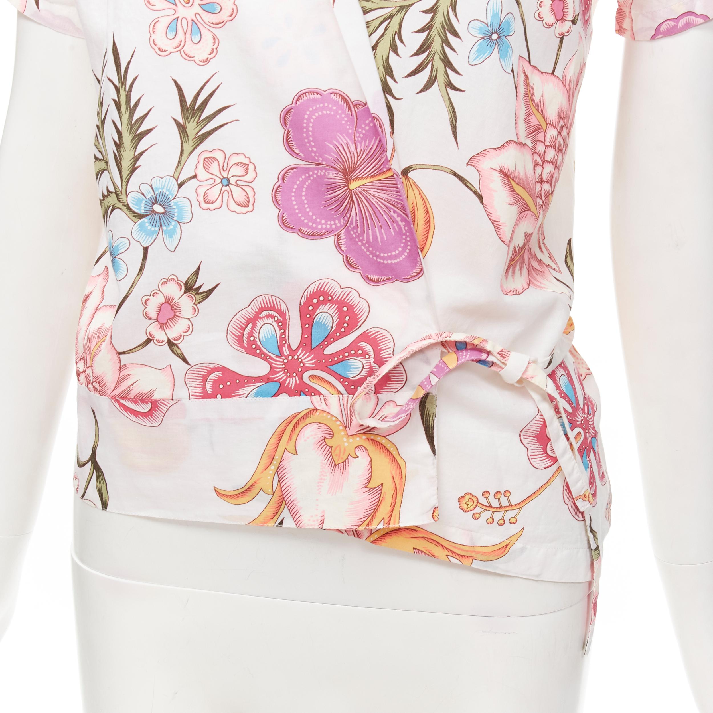 DRIS VAN NOTEN white pink floral print wrap kimono shirt FR38 M
Brand: Dries Van Noten
Material: Cotton
Color: White
Pattern: Floral
Closure: Self Tie
Extra Detail: Wrap kimono front.
Made in: Belgium

CONDITION:
Condition: Very good, this item was