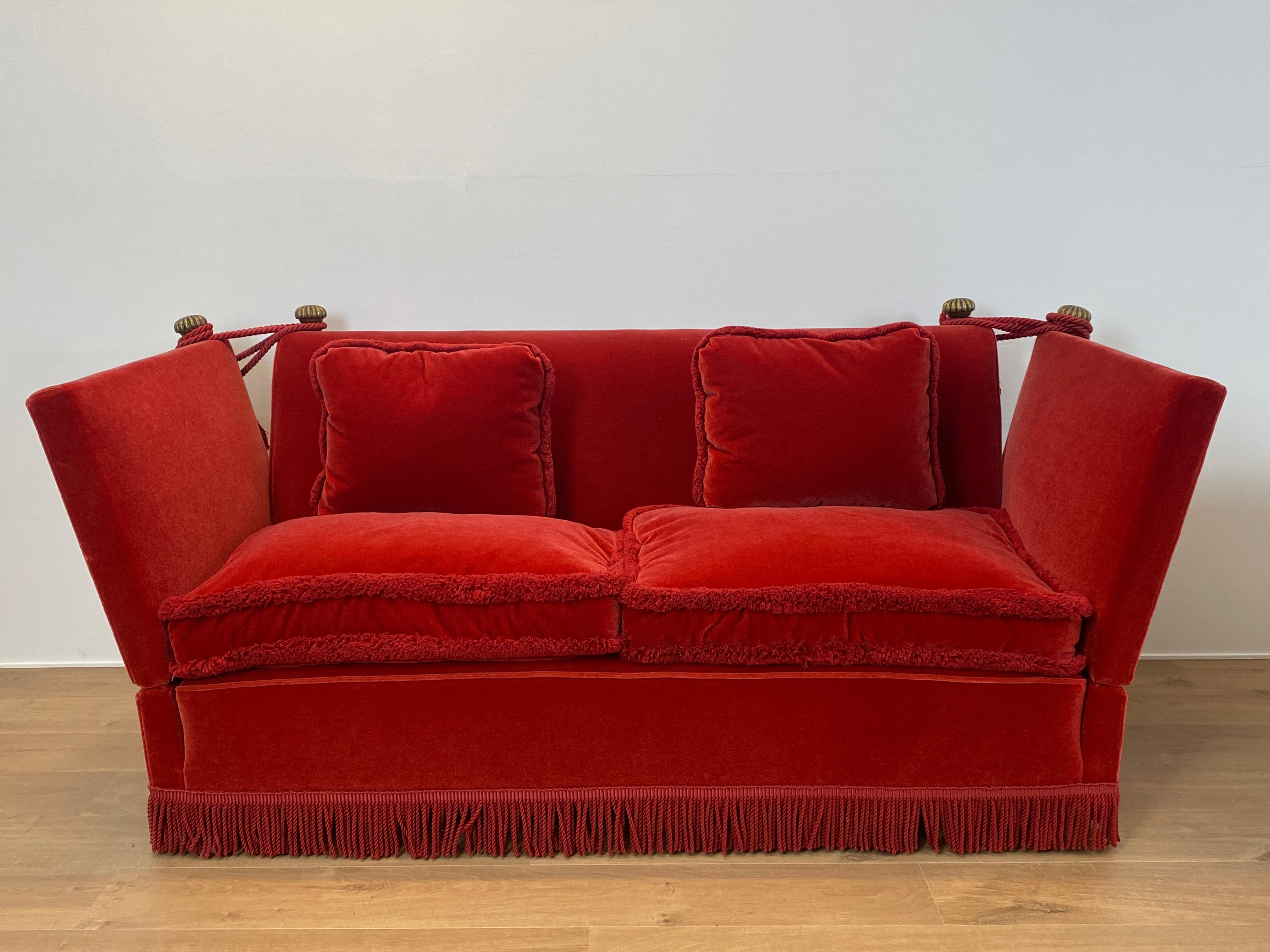Elegant 20th century knoll style sofa,
nice reupholstery using plush Orange-Red material with elegant fringing, the side panels fold down, comfortable seating,
nice warm color.
 Gives your interior a chic glance.