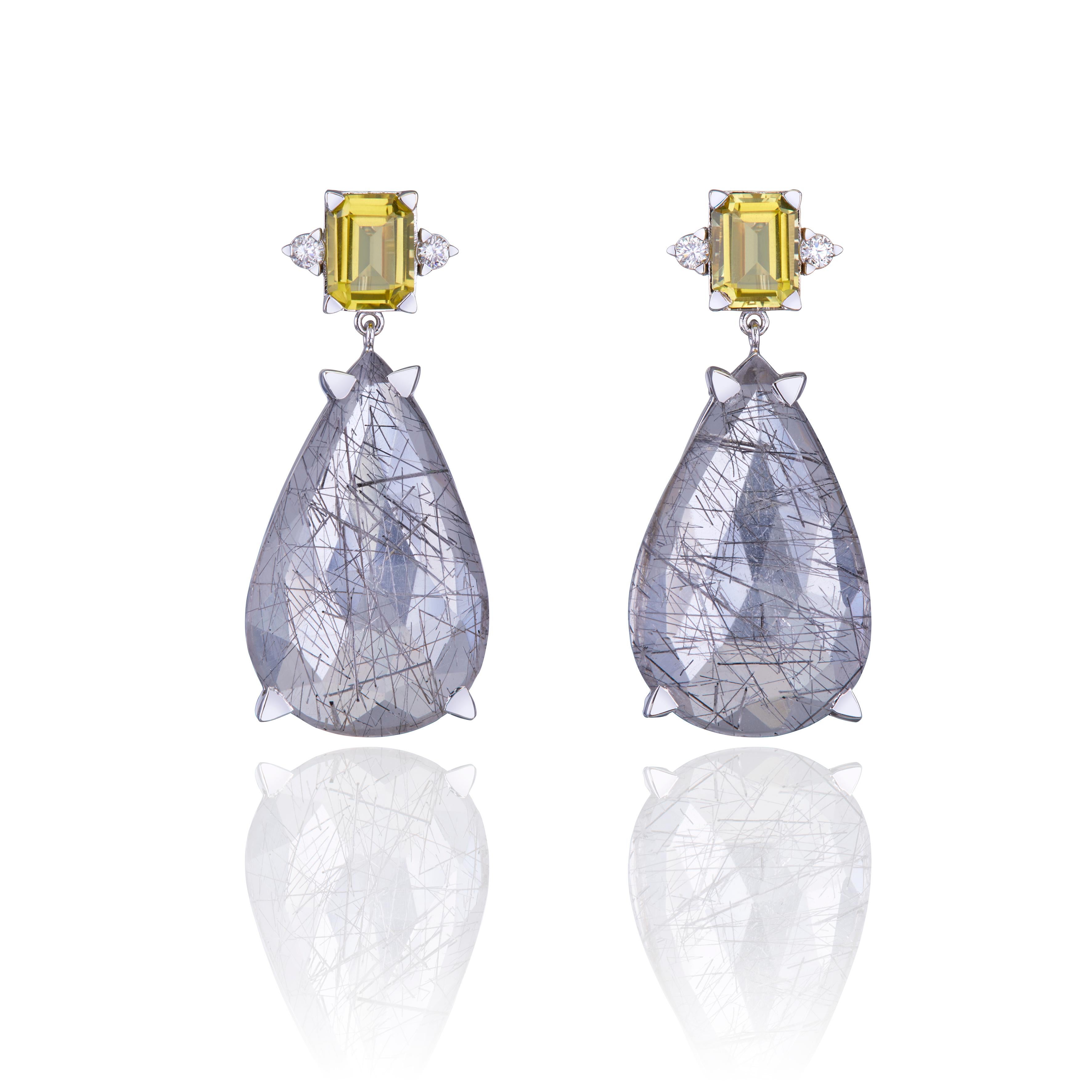 Drop Earrings in 18kt White Gold, with Pear Rutilated Quartz, Yellow Quartz and Diamonds.
This ONE OF A KIND masterpiece comes from the brand Nicofilimon, a brand based in Greece. It's lead designer, Nicofilimon, sees jewellery as an art form that