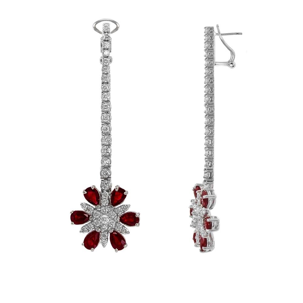 Glamorous and charming long dangle earrings inspired by garden's red daisies beautifully created by 6 pear-shape rubies on each earring, totaling 5.60 carats of rubies, and pedicel made of about two inches of graduated brilliant diamonds with total