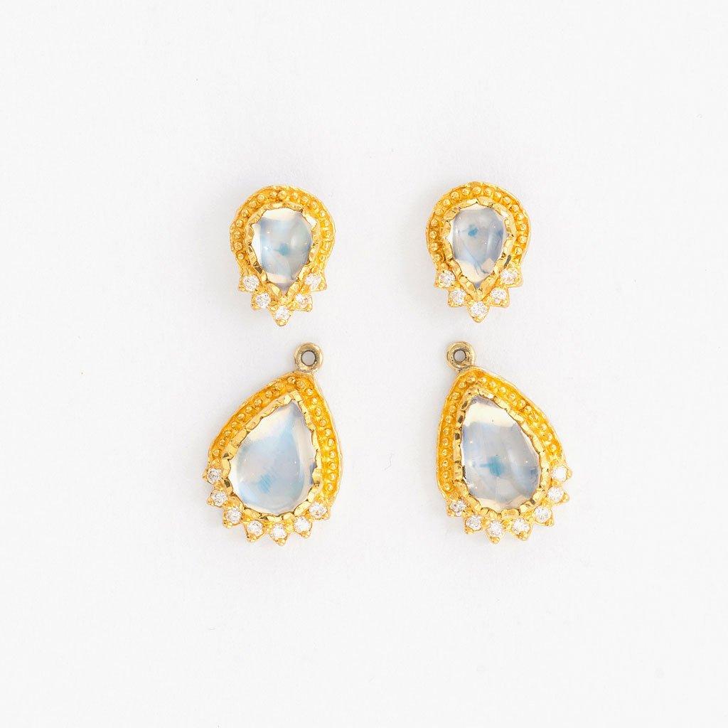Inspired by the energy pulsating throughout nature, Velyan unites pure metals and gemstones into stunning styles that display the grandeur of fine jewelry.

These earrings feature moonstones with white diamond pavé set in 24k yellow gold and