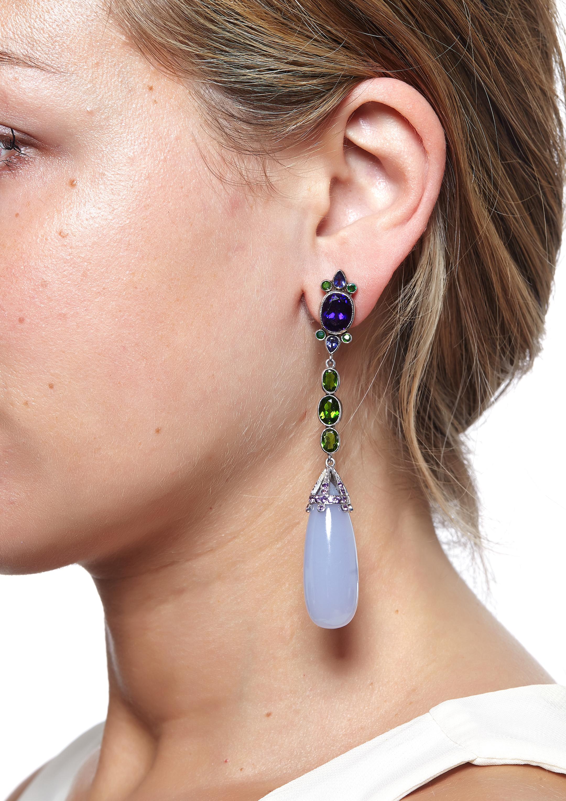 Sabrina Balsky Jewelry
Dangle Natural Blue Chalcedony Earrings Drops from Turkey,  Deep Zambian Amethyst ovals, surrounded by Russian Demantoid, and pear shaped Iolite,  with Chrome Diopside joining to the signature bead cap with Brazilian Amethyst