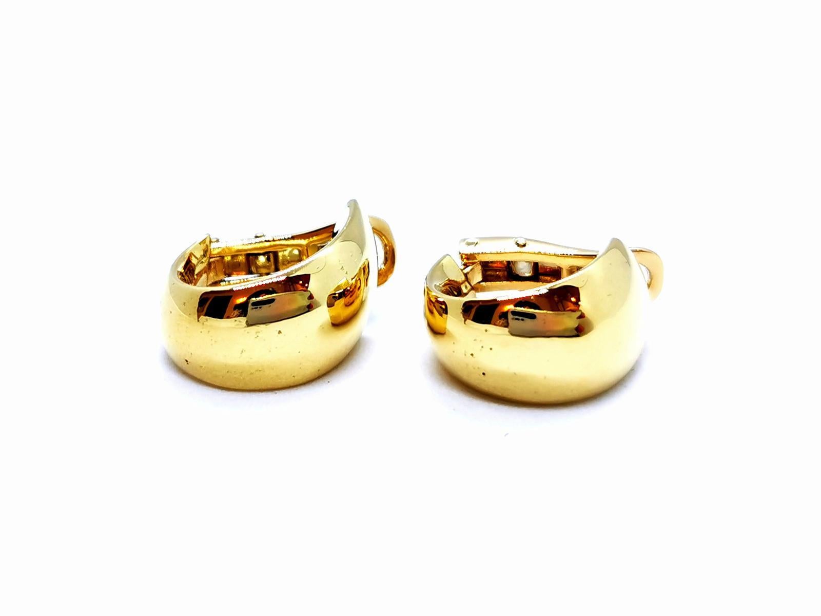 Earrings in yellow and white gold 750 thousandths (18 carats). clips. dimensions: 1.56 x 0.94 cm. total weight: 18.06 g. eagle head punch. excellent condition
