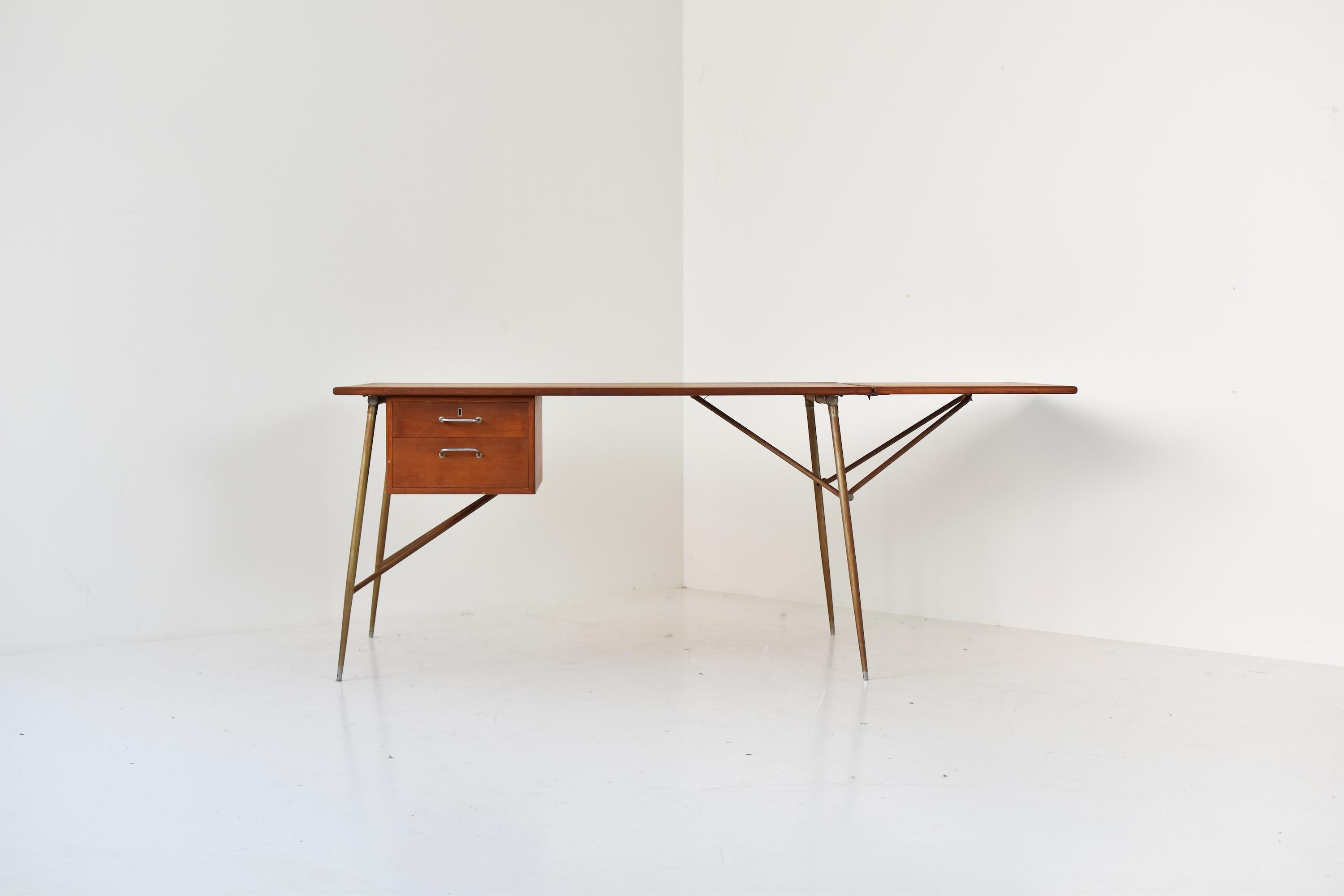 Rare drop leaf desk by Borge Mogensen for Søborg Mobelfabrik, Denmark 1950s. This architectural desk features a nickel plated base and a teak top with extension. Restored with love. Frame could be polished upon request. Masterpiece.