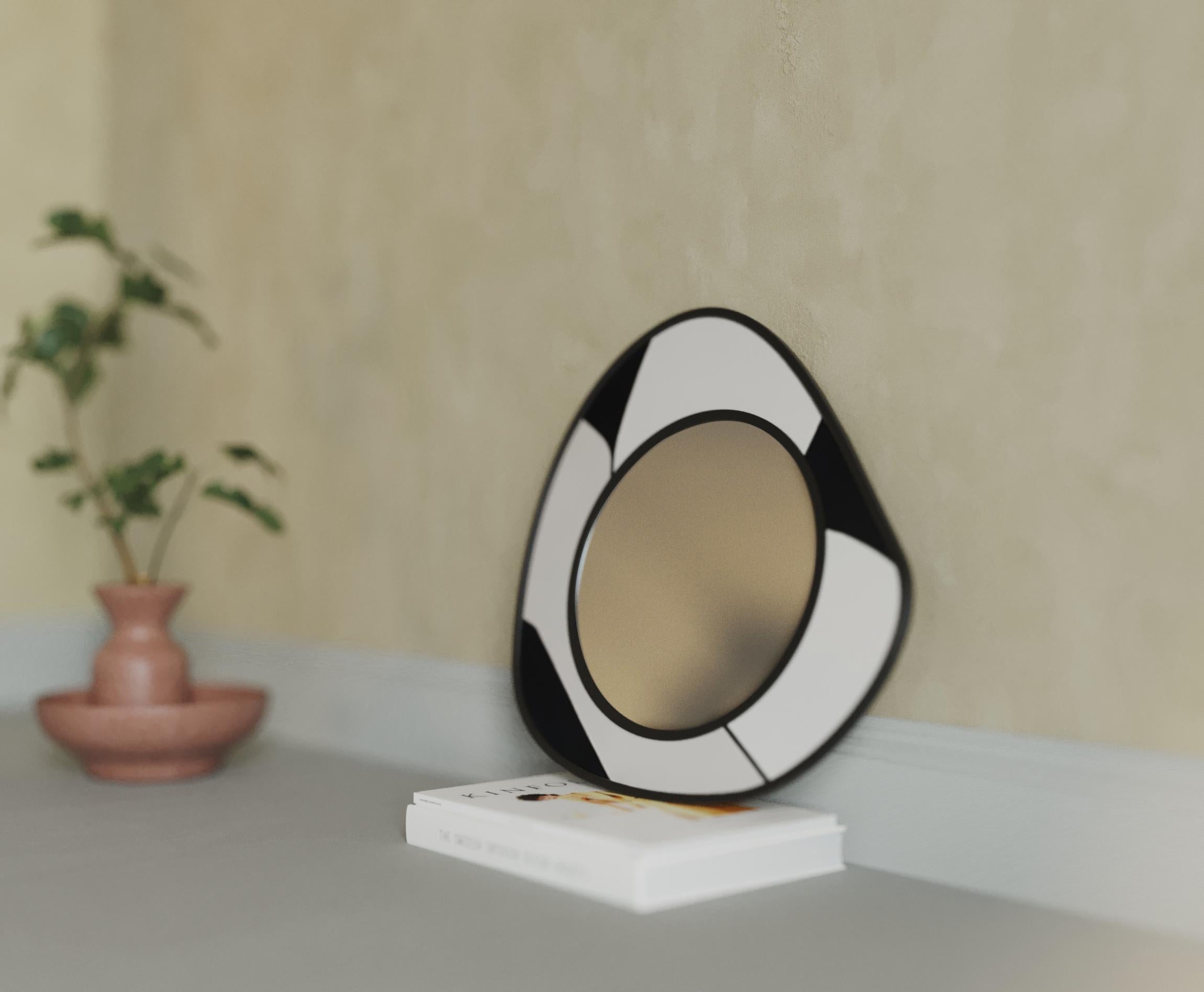 Drop mirrors break away from the traditional perception of mirrors with their organic and unconventional form, bringing a sleek and modern touch to any space. If you're looking for a unique way to decorate empty walls, Drop mirrors add a dynamic