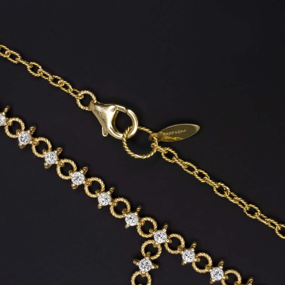  drop necklace shimmers with 1.40ct of very high quality G-H VS diamonds. Bright white, exceptionally clean, and dazzlingly vibrant, the diamonds make a gorgeous impact! The 18k yellow gold settings add rich contrast and a luxurious touch. Signed by