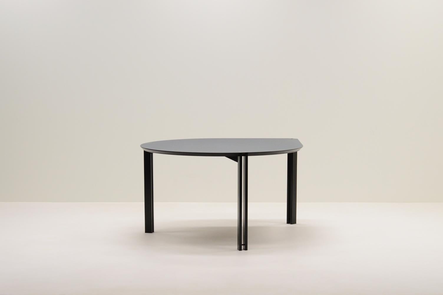 Drop dining table by Harvink, 1980s The Netherlands. Postmodern design table in the shape of a drop. Black laquered metal legs and a Formica veneer multiplex top with a beveled edge. The tip of the top is a 90 degree angle that fits perfect in a