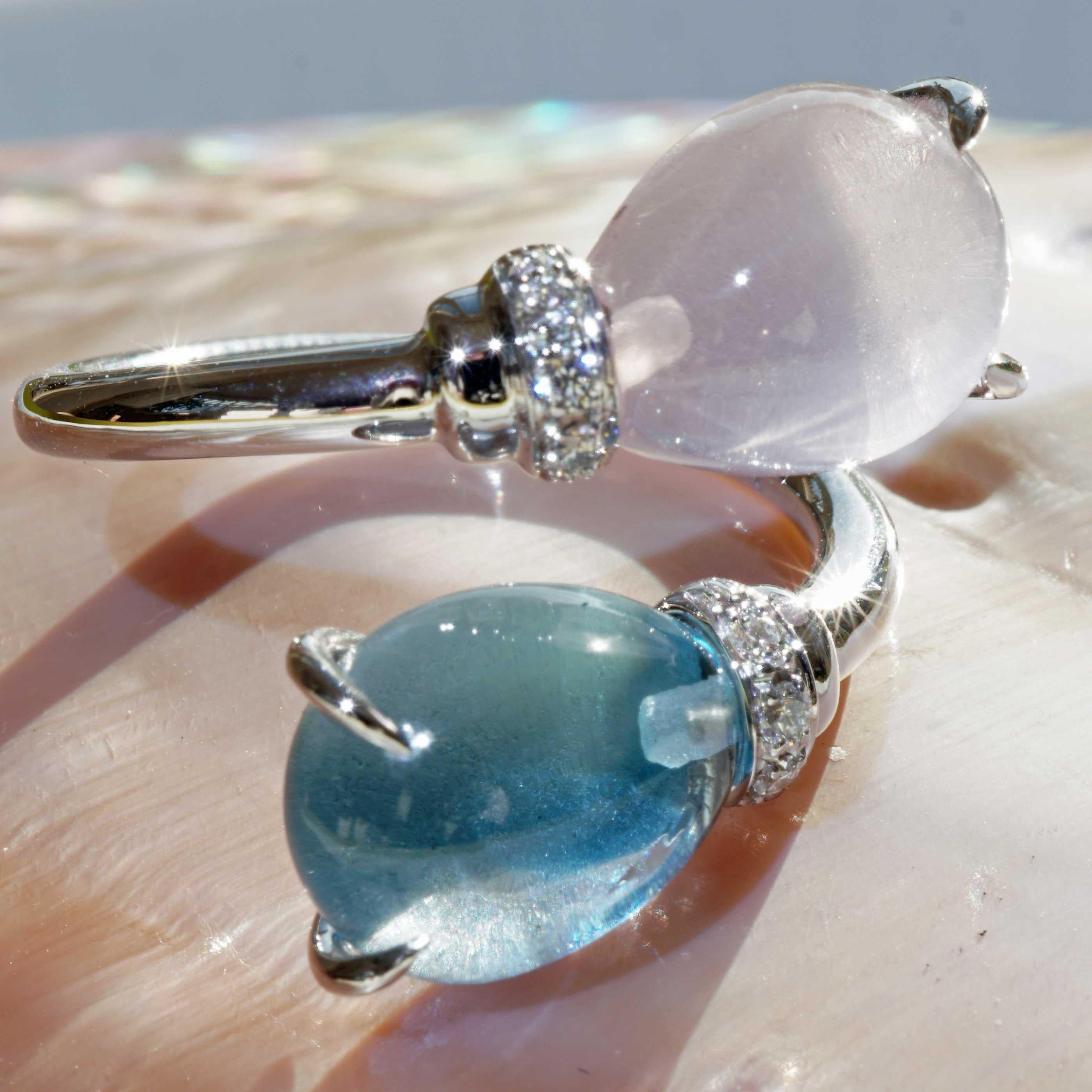Drop ring made in a traditional Italian goldsmith in Valenza, delightful design, ring with a blue topaz cabochon drop with a smooth surface and a roughened bottom surface (beautiful effect) and a rose quartz cabochon drop set as if it were floating,