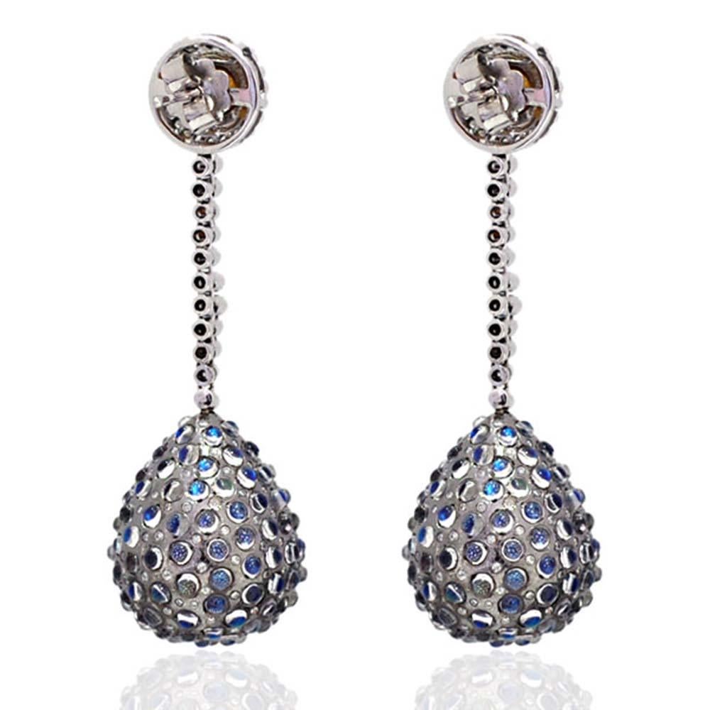 Drop shape Designer Diamond and moonstone dangle Earring in Gold and Silver is lovely and can be paired with any formal or casual look. 


18kt gold: 8.52gms
Diamond: 2.46cts
Moonstone: 11.58Cts
