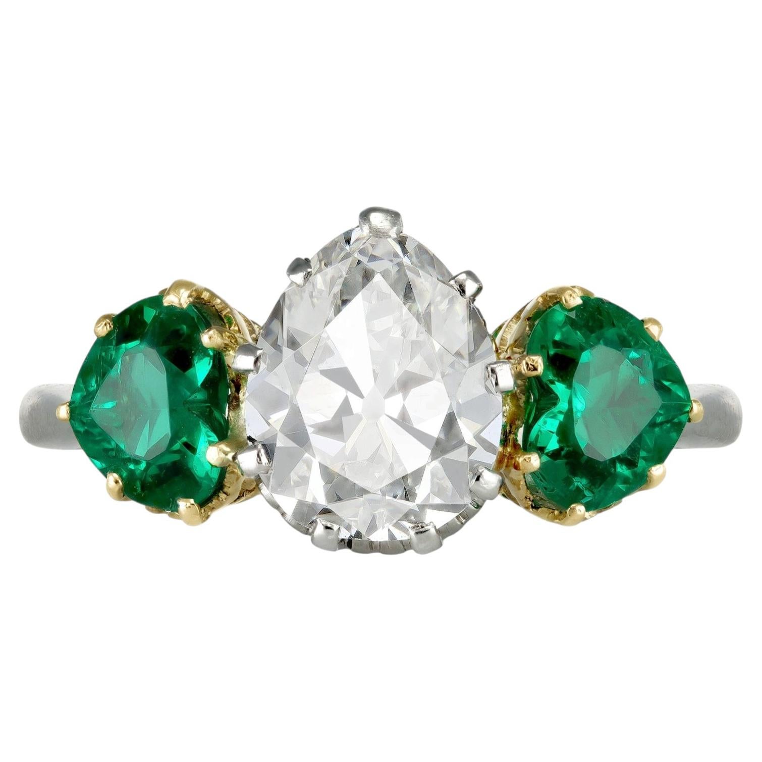 Drop shape old mine diamond and Colombian emerald ring, circa 1920. For Sale