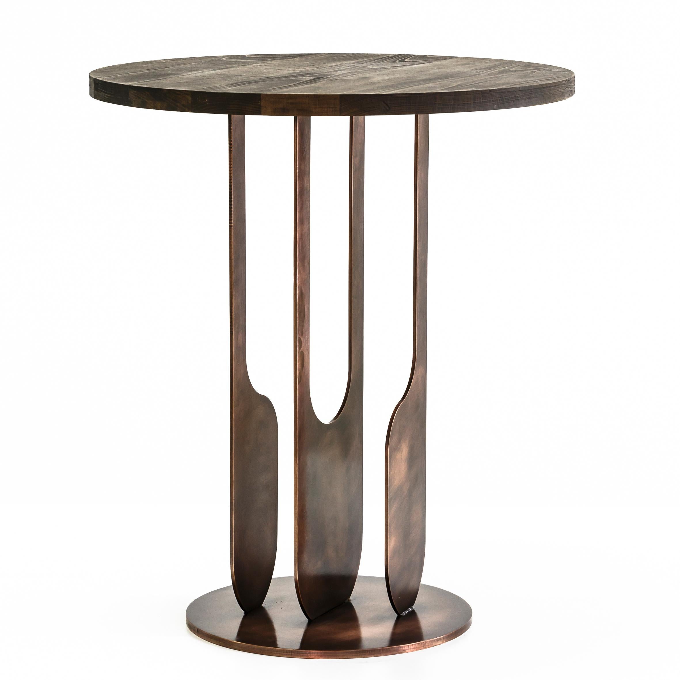 Drop side table by Egg Designs
Dimensions: 60 L X 60 D X 58 H cm 
Materials: Antique copper plated steel, stained oak top

Founded by South Africans and life partners, Greg and Roche Dry - Egg is a unique perspective in contemporary furniture