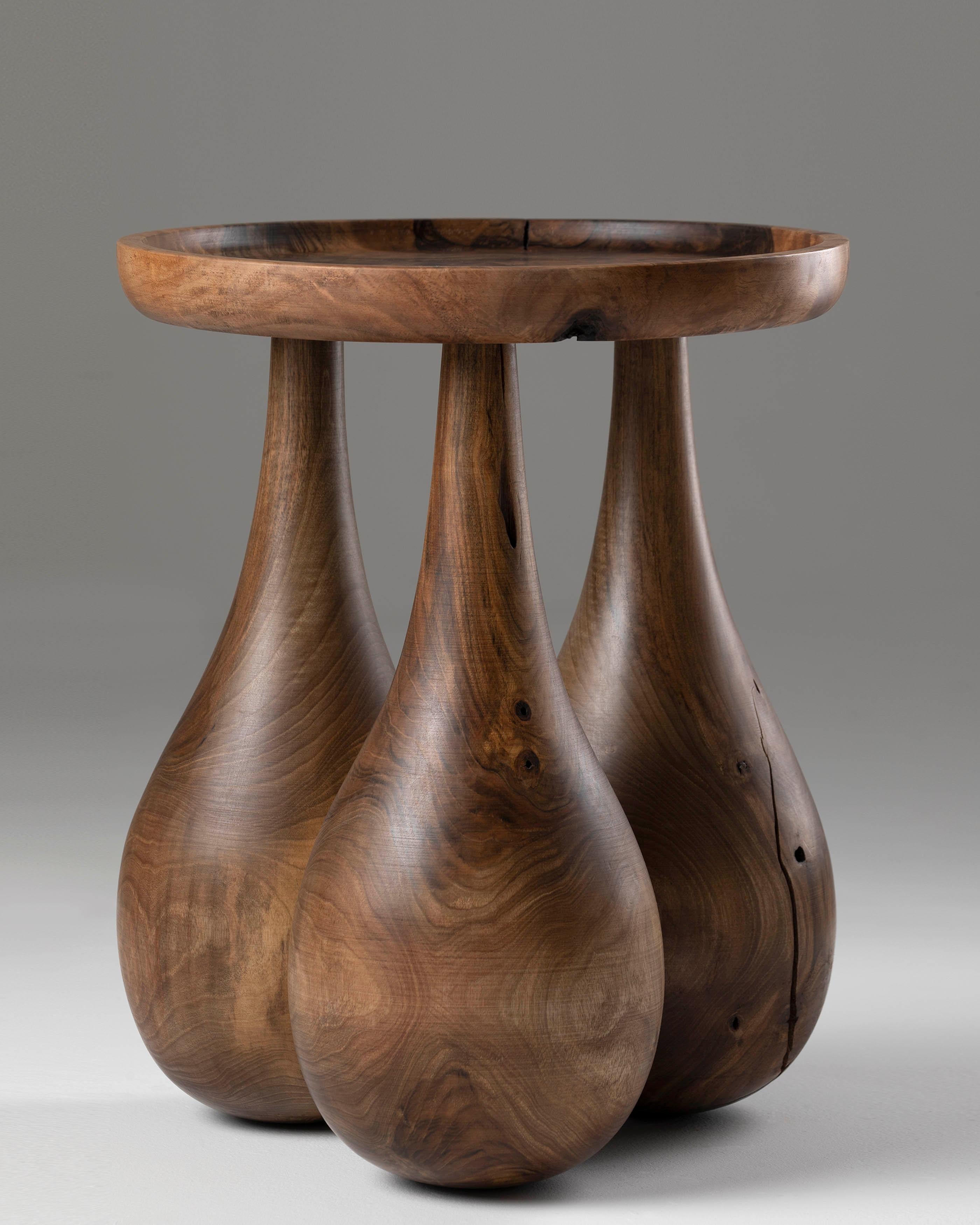 Drop Side Table by Nana Zaalishvili
Dimensions: Ø 40 x H 50 cm.
Materials: Solid walnut.

Created and handcrafted in Tbilisi using domestic walnut wood, the ‘Drop’ Table combines traditional craftsmanship with the contemporary language of sinuous