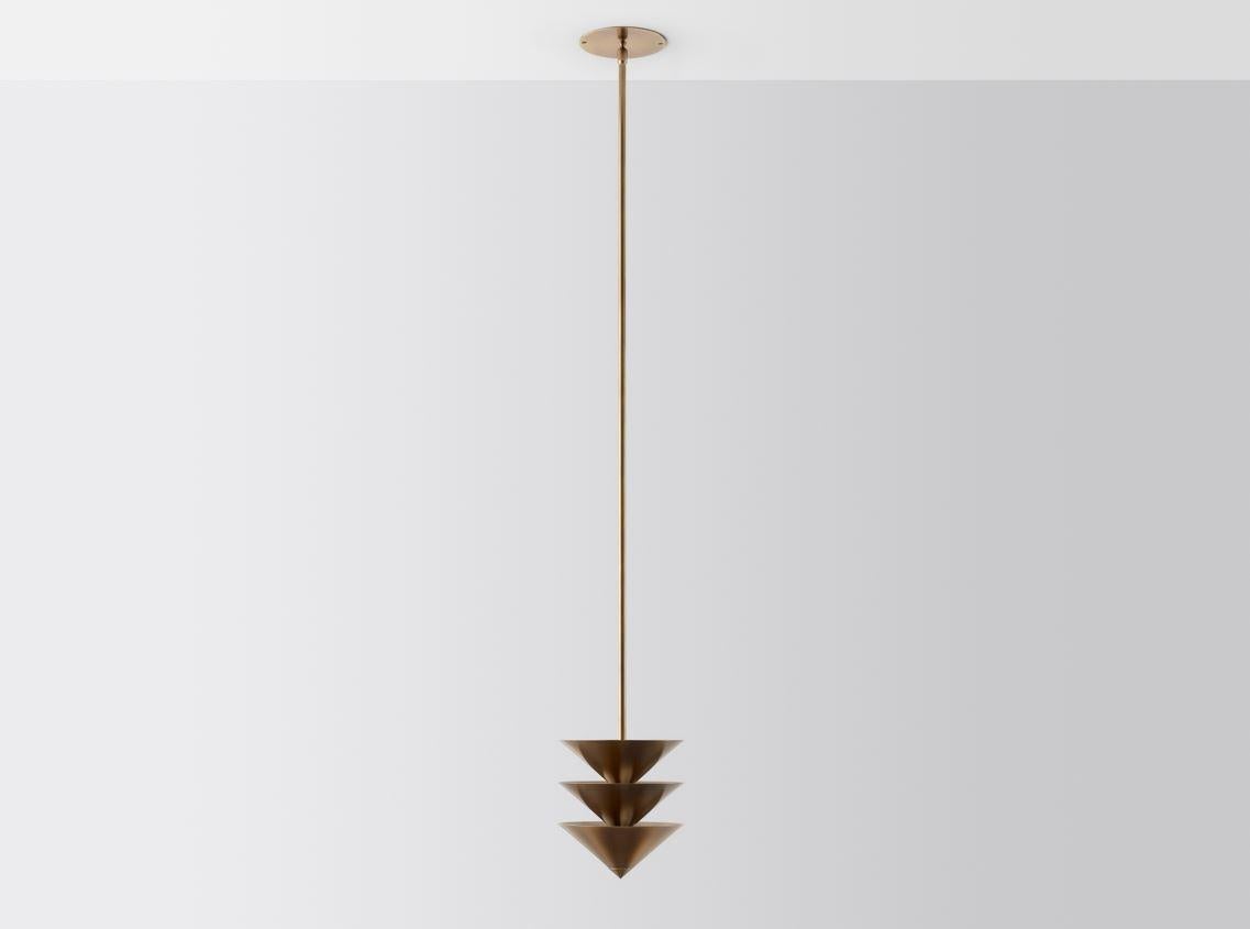 Drop stack 3 by Volker Haug 
Pyramid Scheme series
Dimensions: w 21, d 21, h 53 cm
Support: 15 cm 
Suspension: minimum 53 cm
Material: Brass
Finishes: Polished, brushed or bronzed brass; enamel or chrome plated. 
Custom finishes available on