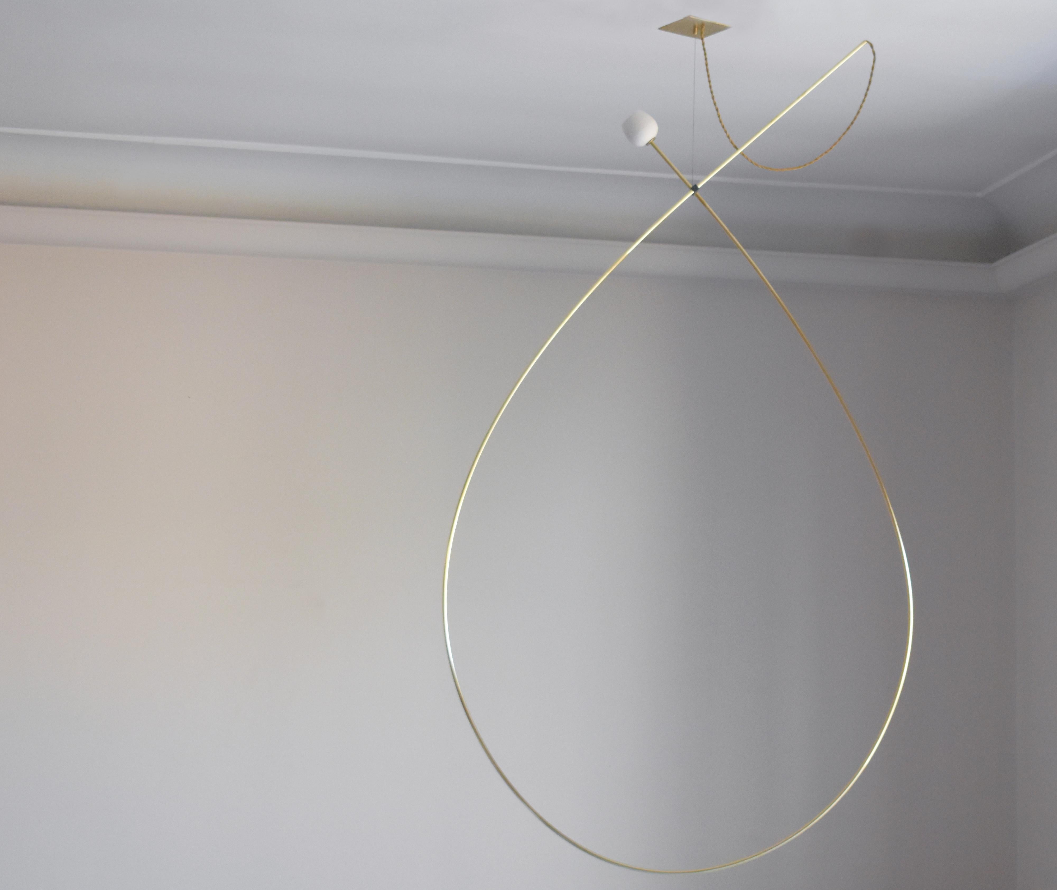 Drops Brass Hanging Light Object by Periclis Frementitis
One of a Kind.
Dimensions: D 70 x H 160 cm. 
Materials: Polished and oxidized brass, porcelain, G4 LED bulb.

Due to the handmade nature of the piece, dimensions may vary up to 10%
for