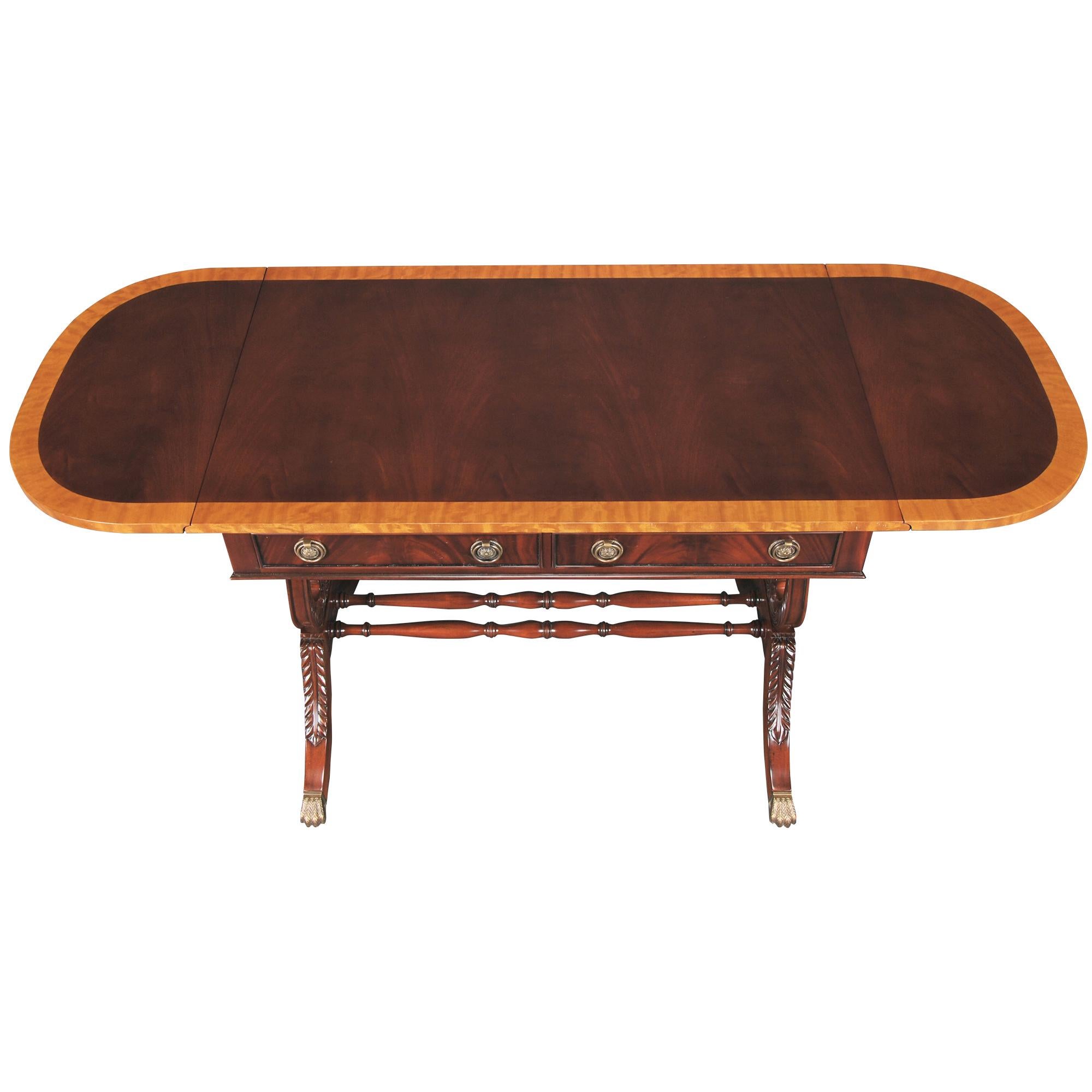 Yet another item in the lyre collection, our Dropside Lyre or Harp Desk has a beautifully crafted top featuring figural mahogany and satinwood, all of which is hand cut and pieced together by skilled artisans. The Dropside Lyre or Harp Desk also has