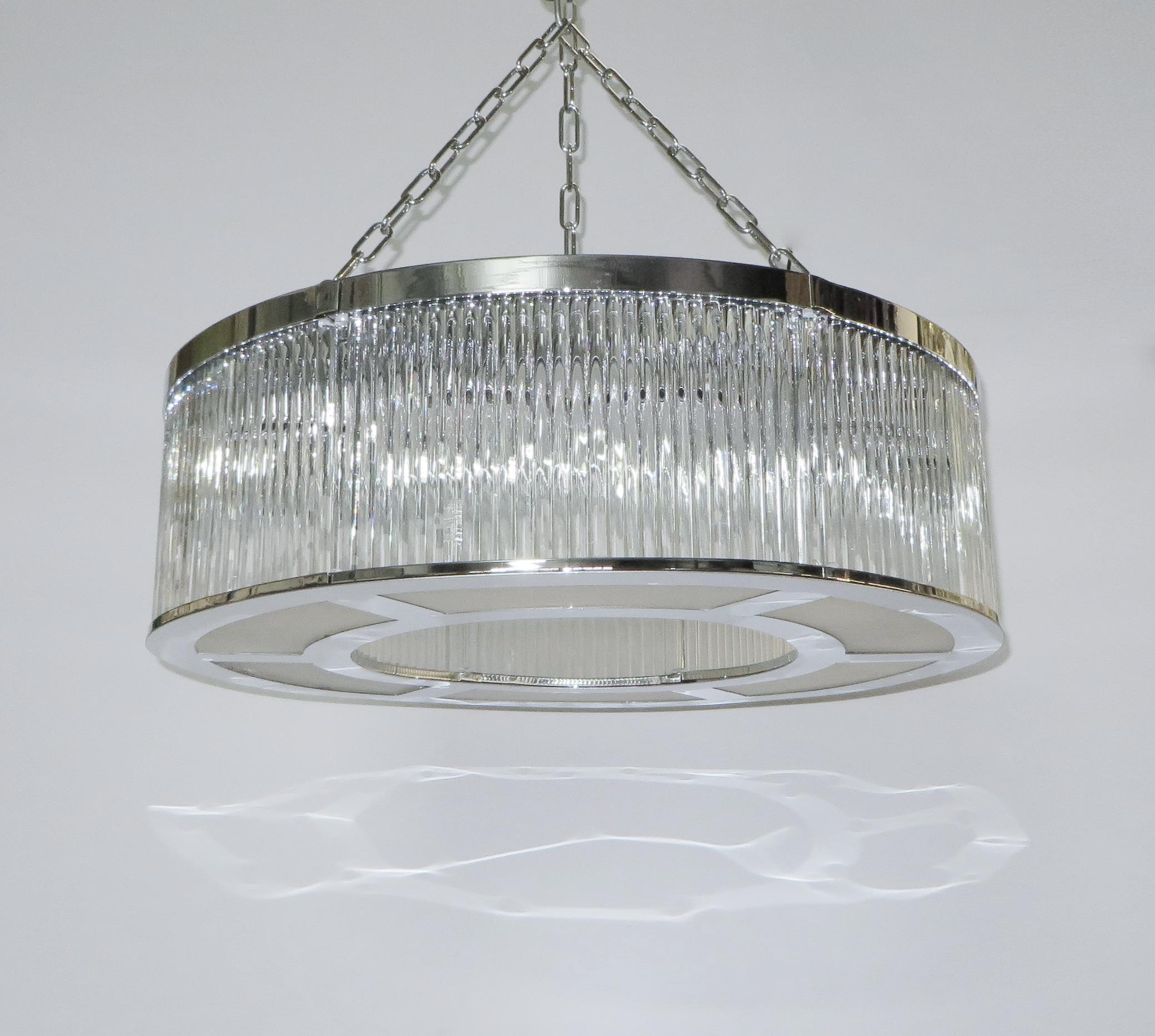 Italian art deco style drum chandelier with double layers of thin clear Murano glass rods mounted on chrome finish structure / Made in Italy by Fabio Ltd
8 lights / E26 or E27 type / max 60W each
Measures: diameter 31.5 inches, height 12 inches plus