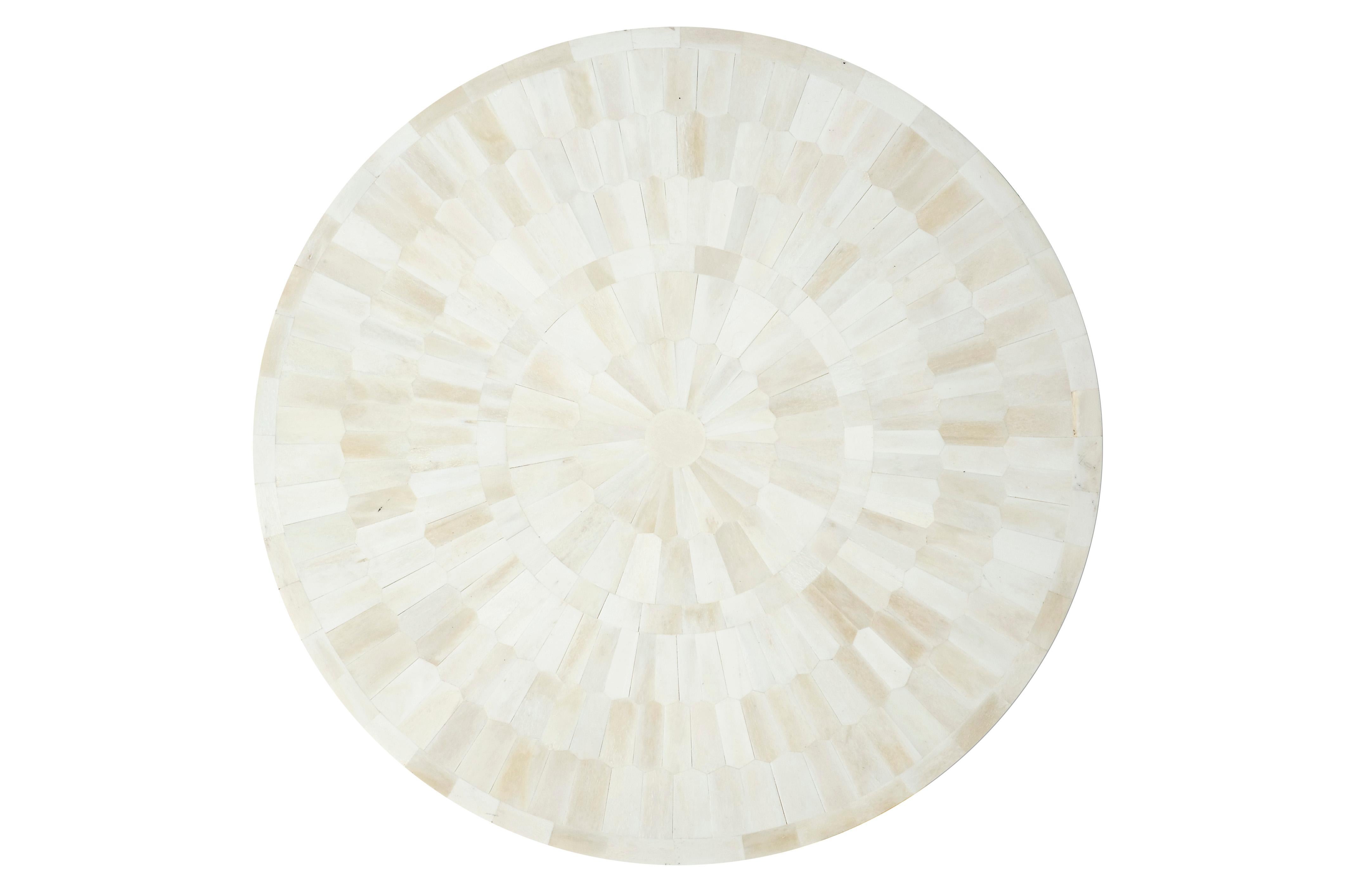 This handcrafted end table/stool offers tranquility to any space. Hundreds of hexagonal bone chips are individually hand shaped and mounted on a wooden drum form to create this harmonious tone-on-tone patterned stool. It can be customized in size