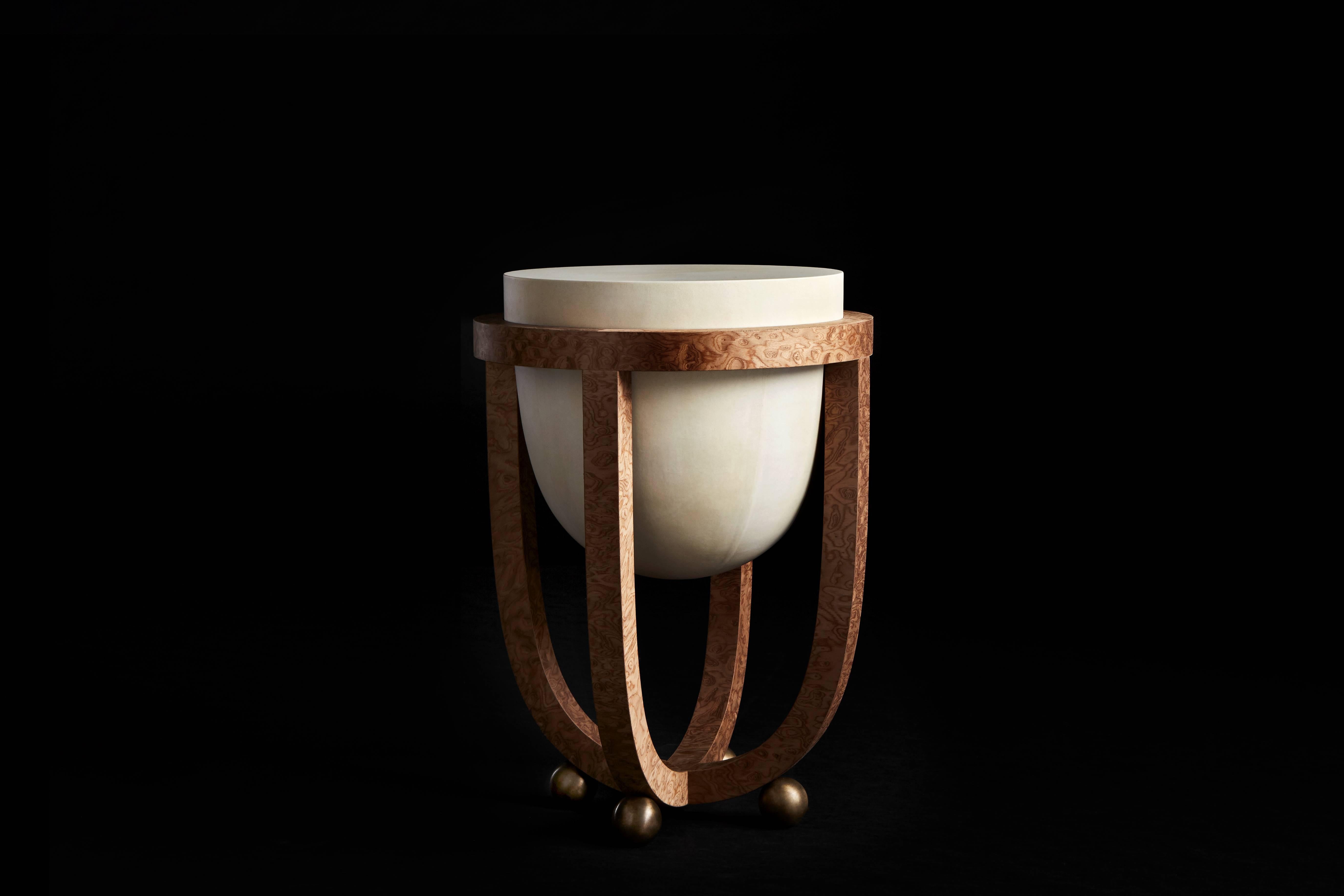 The Drum series references Tombak, a foundational instrument in Persian music, as a point of departure. Parchment is hand-stretched over the table surface, and the veneered legs curve to echo the shape of the suspended parchment volume. 

Natural