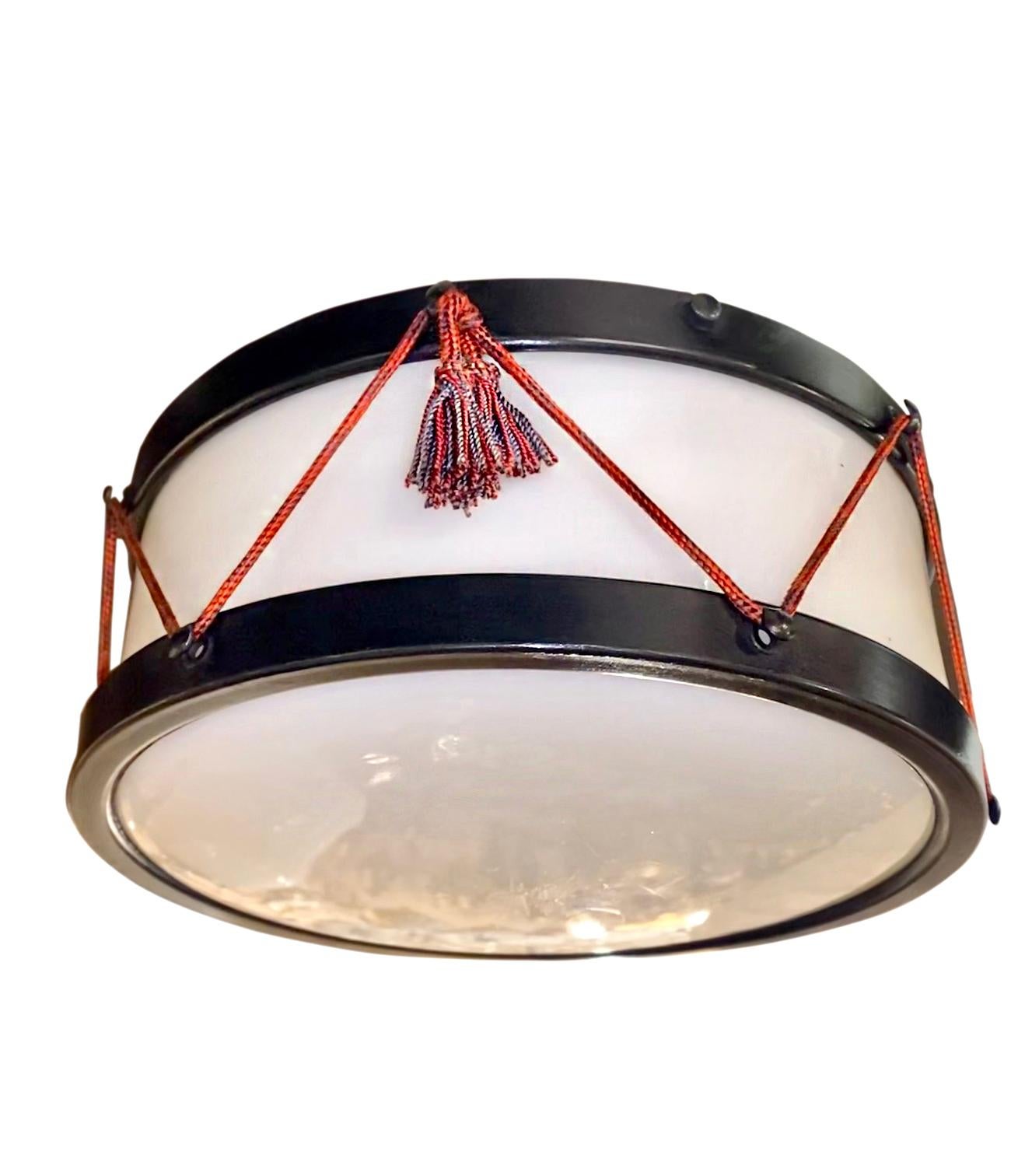 A circa 1940s French painted tole drum-shaped light fixture with milk glass inset.

Measurements:
Diameter: 12