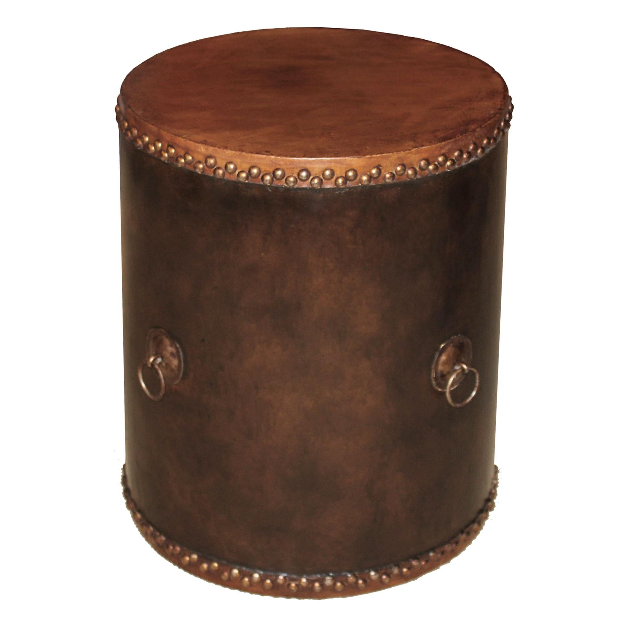 Contemporary wood and leather drum can be used as a side table next to a lounge chair or as a plant stand.
