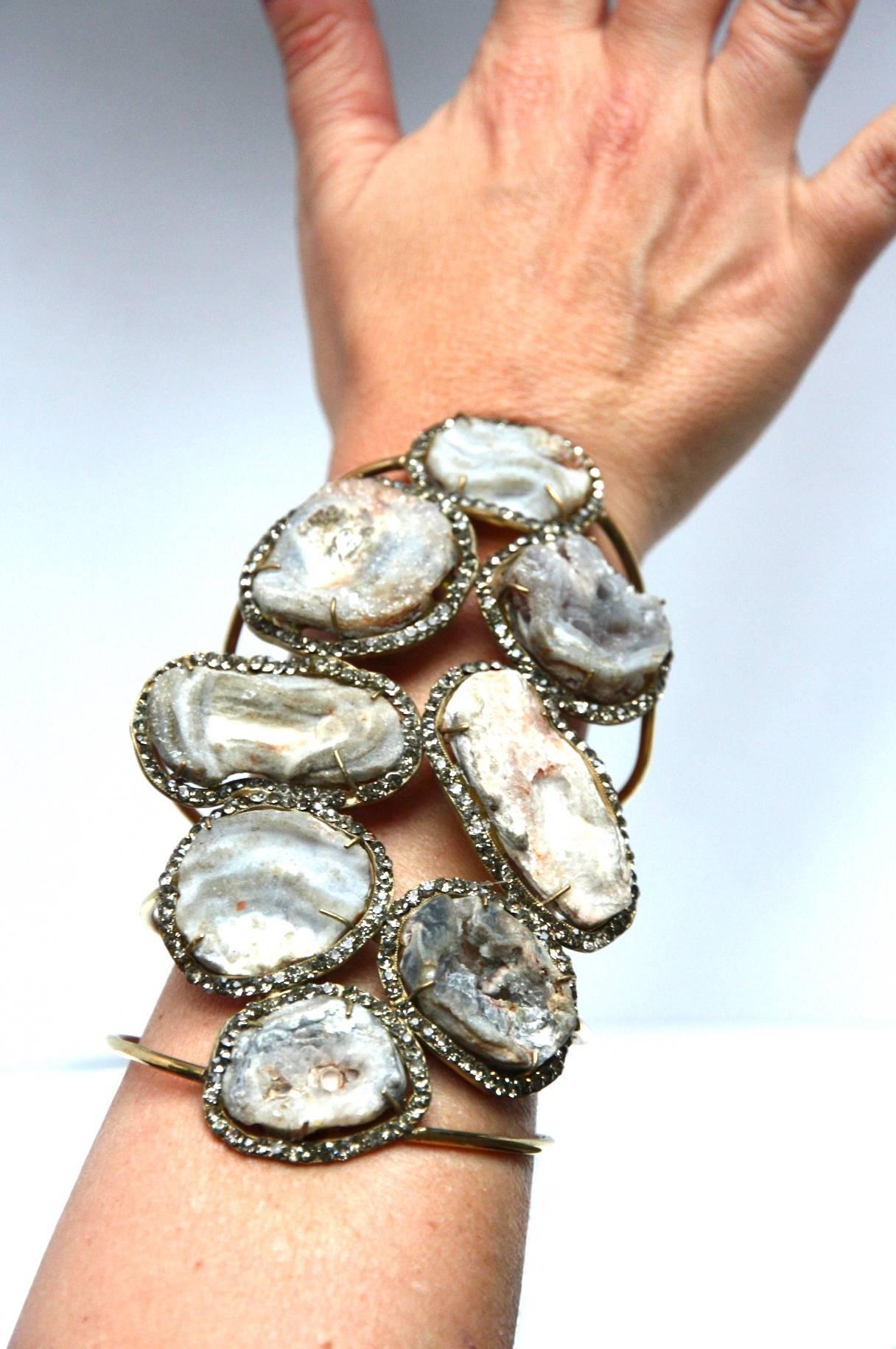 Incredible Bangle with druzy agata stone surrounded by fumè quartz bronze linked.
Very statuesque pieces for sure very unique one.
All Giulia Colussi jewelry is new and has never been previously owned or worn. Each item will arrive at your door