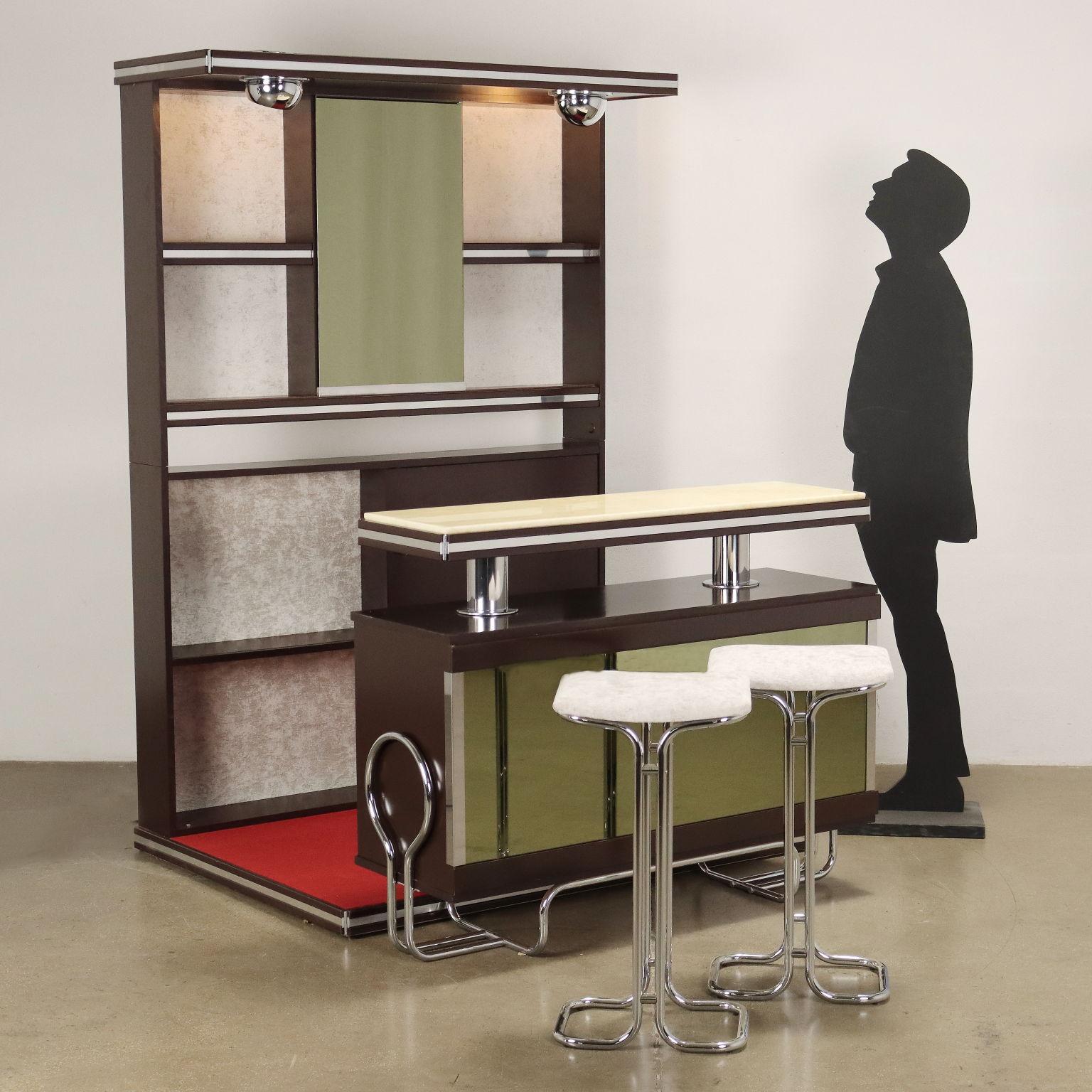 Bar cabinet with wall element with bottle holder compartments with sliding door and adjustable spotlights, platform, counter element, with storage compartment and functioning refrigerator, pair of stools. Lacquered wood, velvet upholstery, chromed